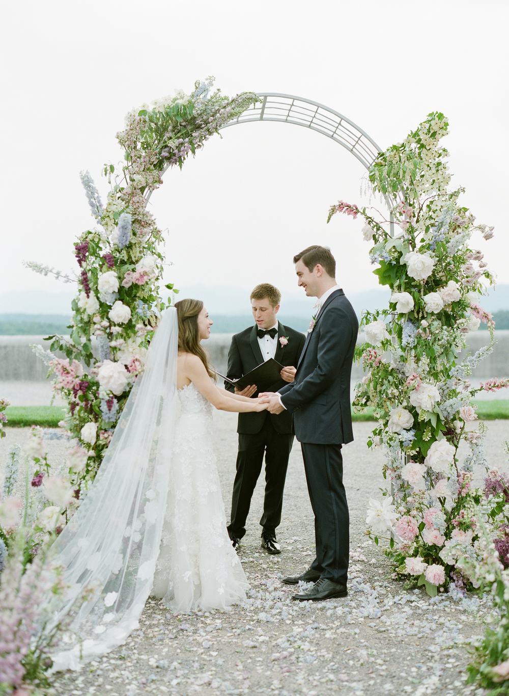 french garden floral arch at wedding ceremony