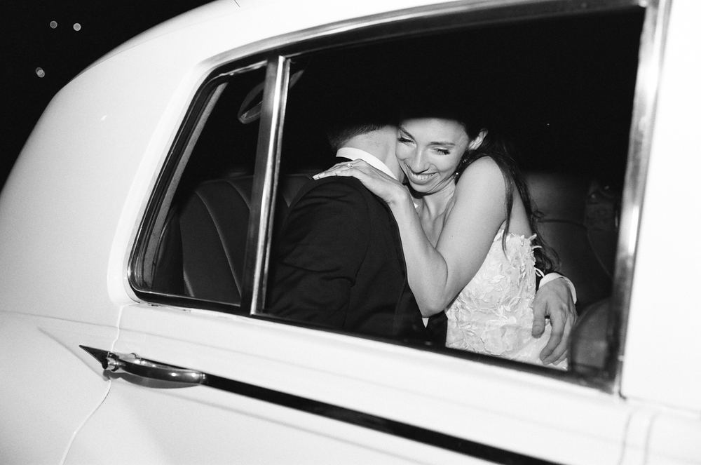 wedding couple in vintage car