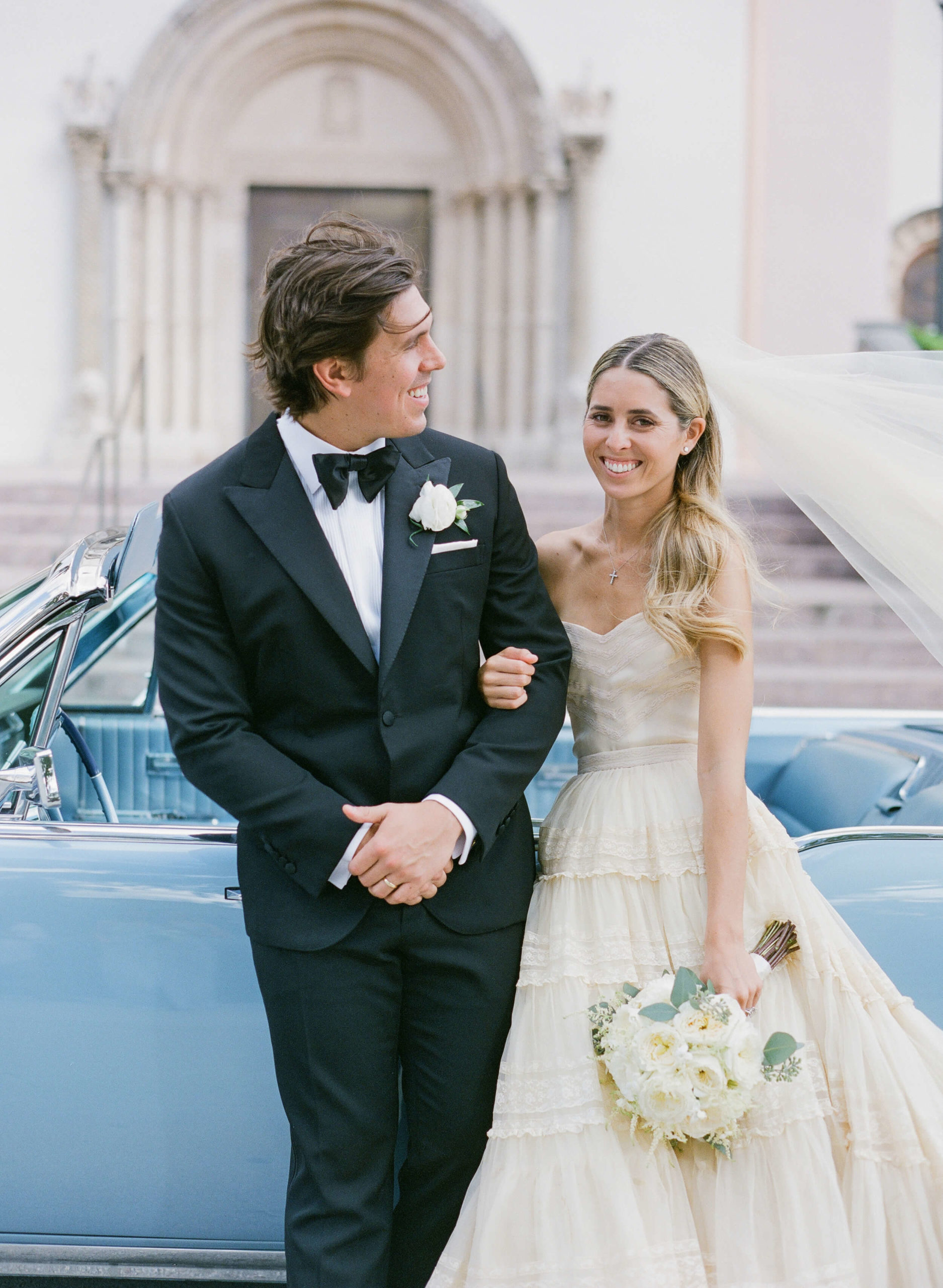 Eunice Kennedy Shriver wore her grandmother's Dior wedding dress to get married in Miami to Michael "Mikey" Garcia. They were married at St. Patricks Catholic Church and drove away in a baby blue 1965 Lincoln Continental.