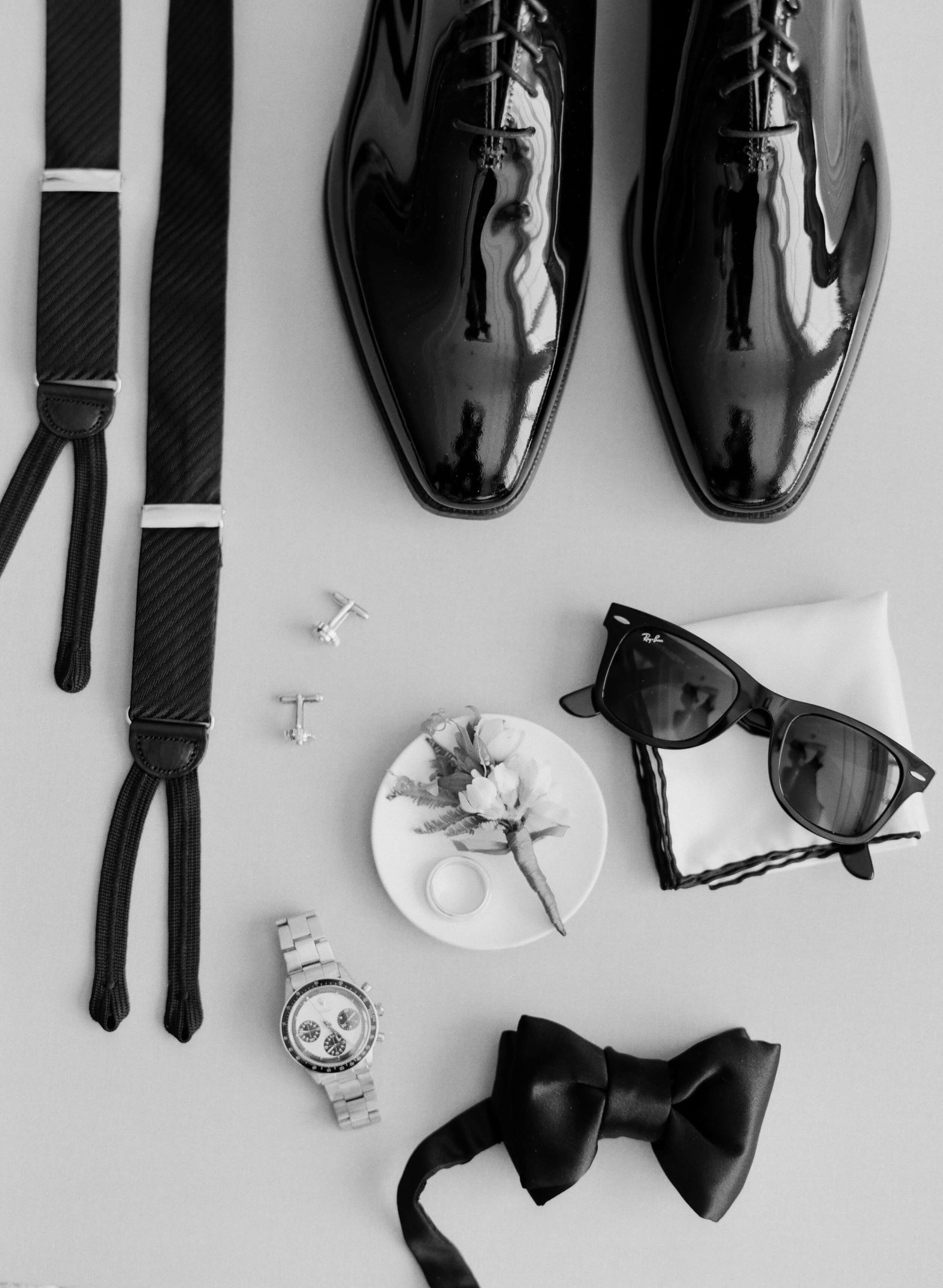 grooms shoes, bow tie, suspenders, cuff links and sunglasses