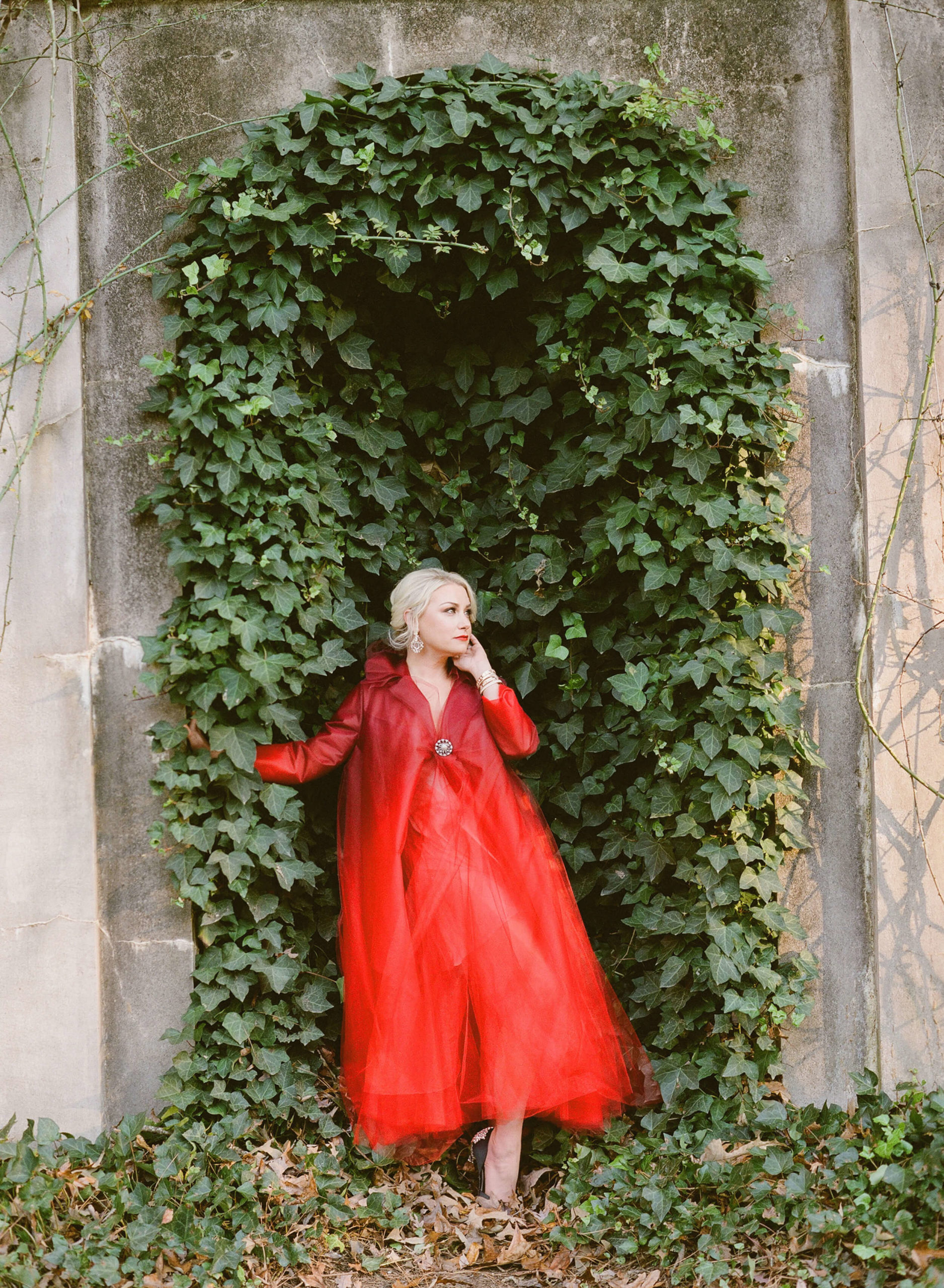 woman in red gown for holiday shoot