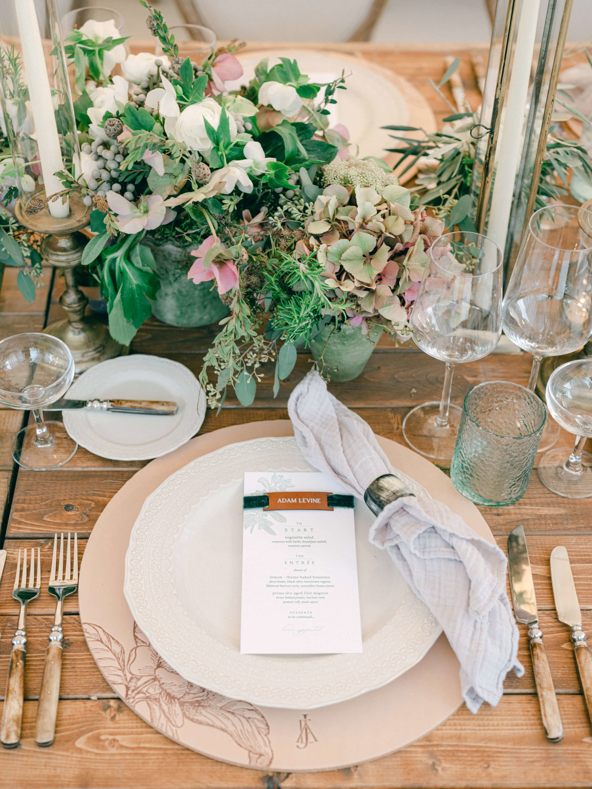 formal dinner place setting with floral arrangements