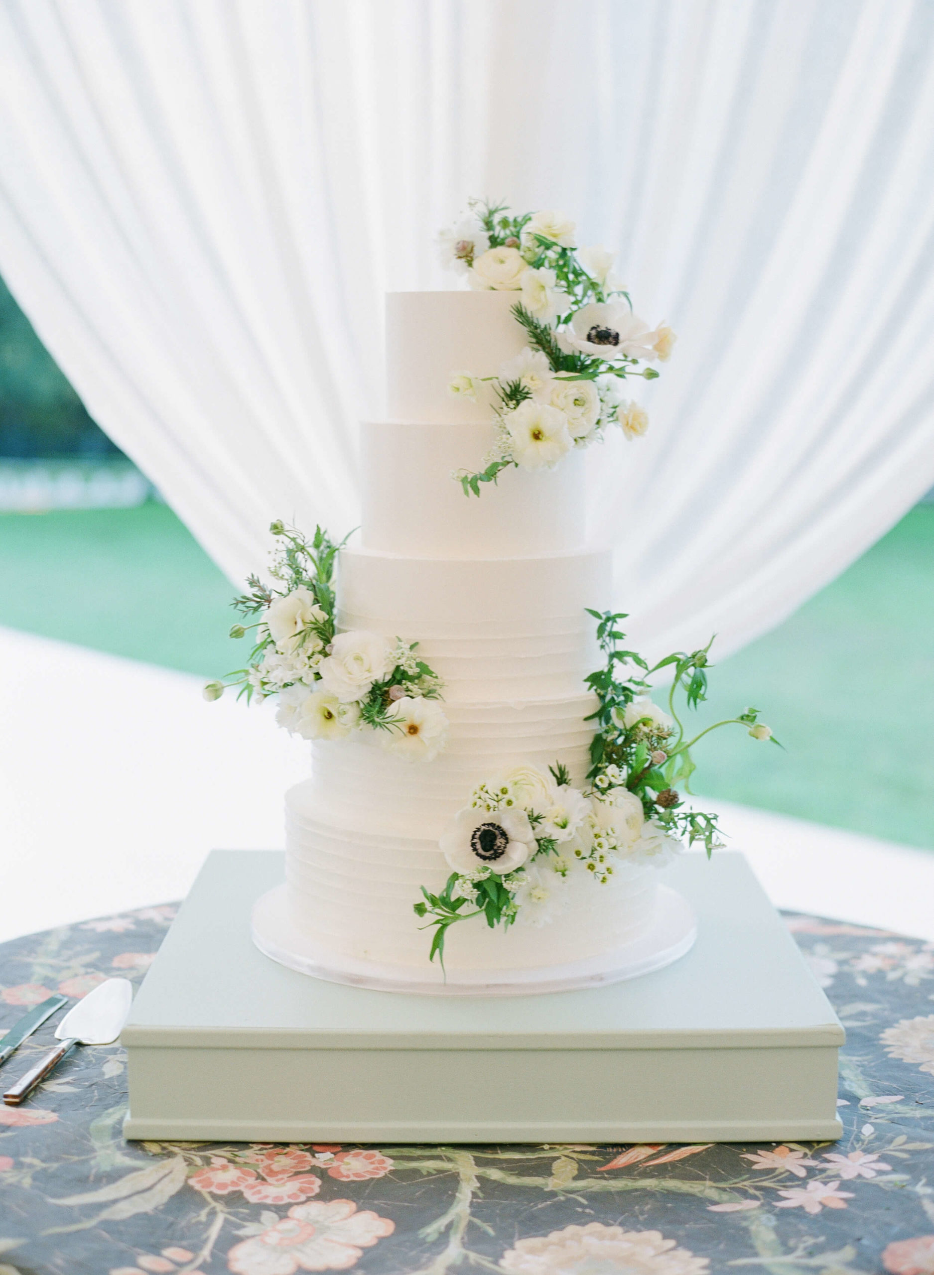 five tier white vanilla chiffon cake with floral decoration