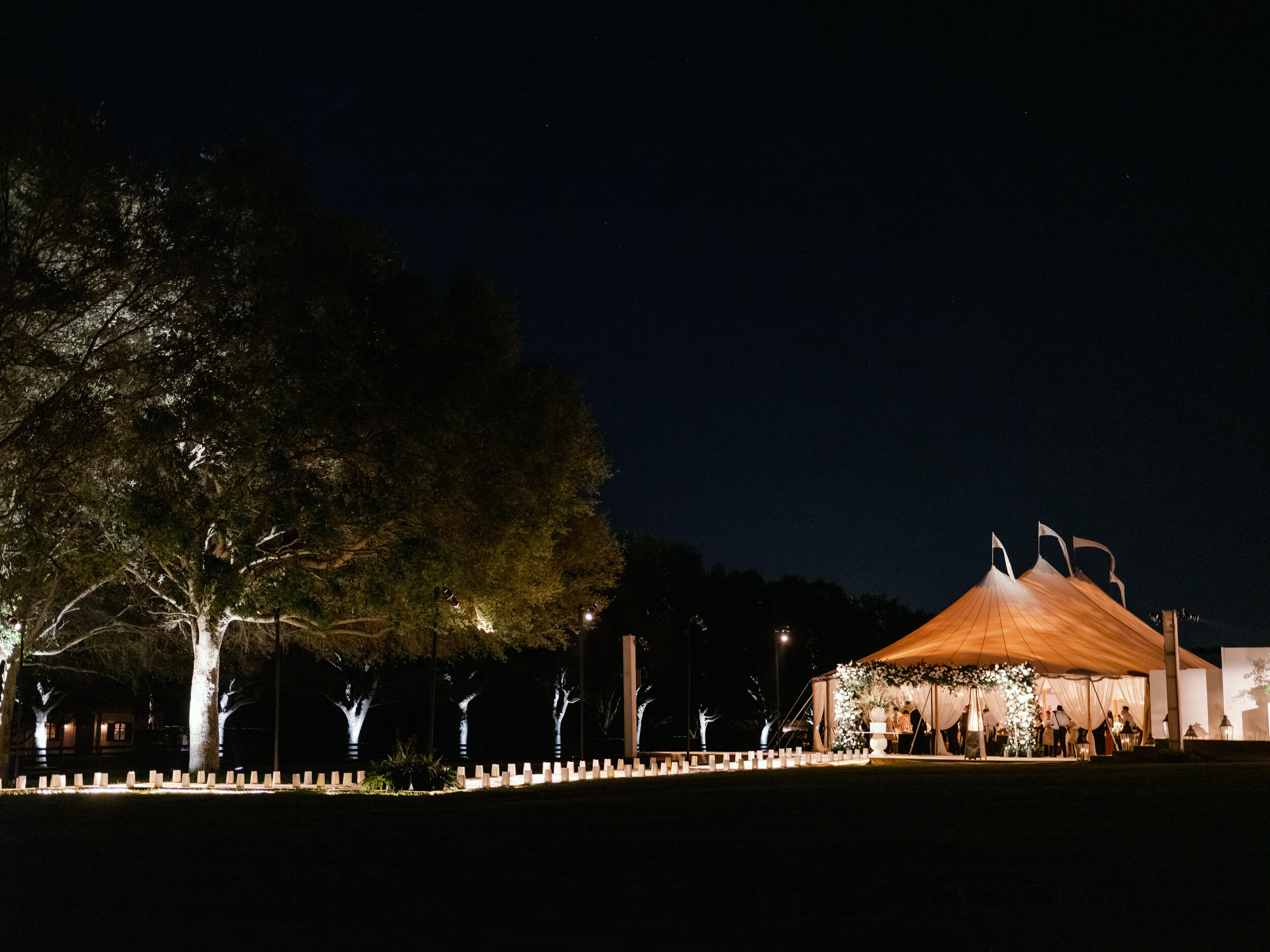 nighttime outside the dinner tent at at-home wedding in Tampa
