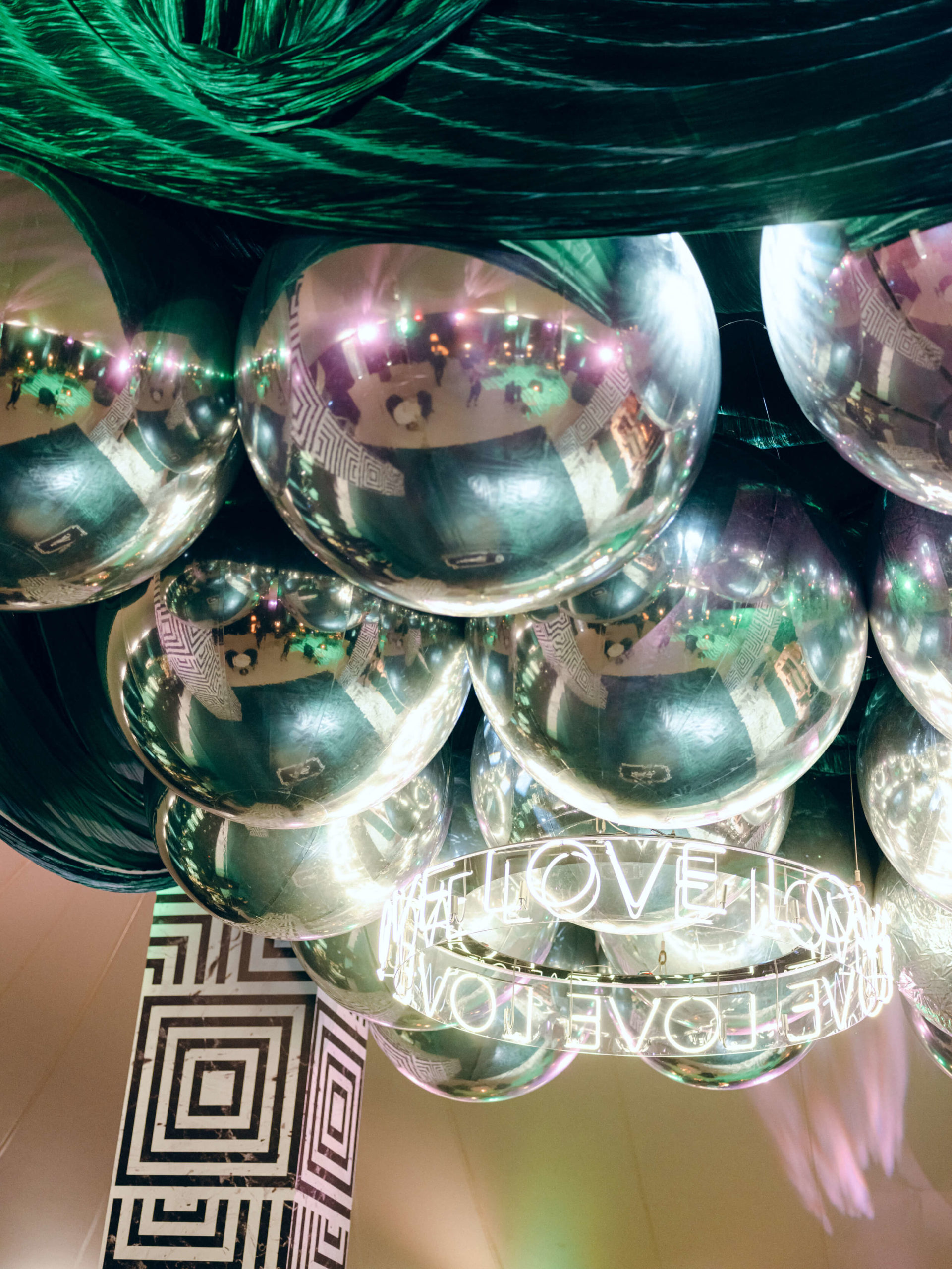 silver reflective balls decorate dance floor