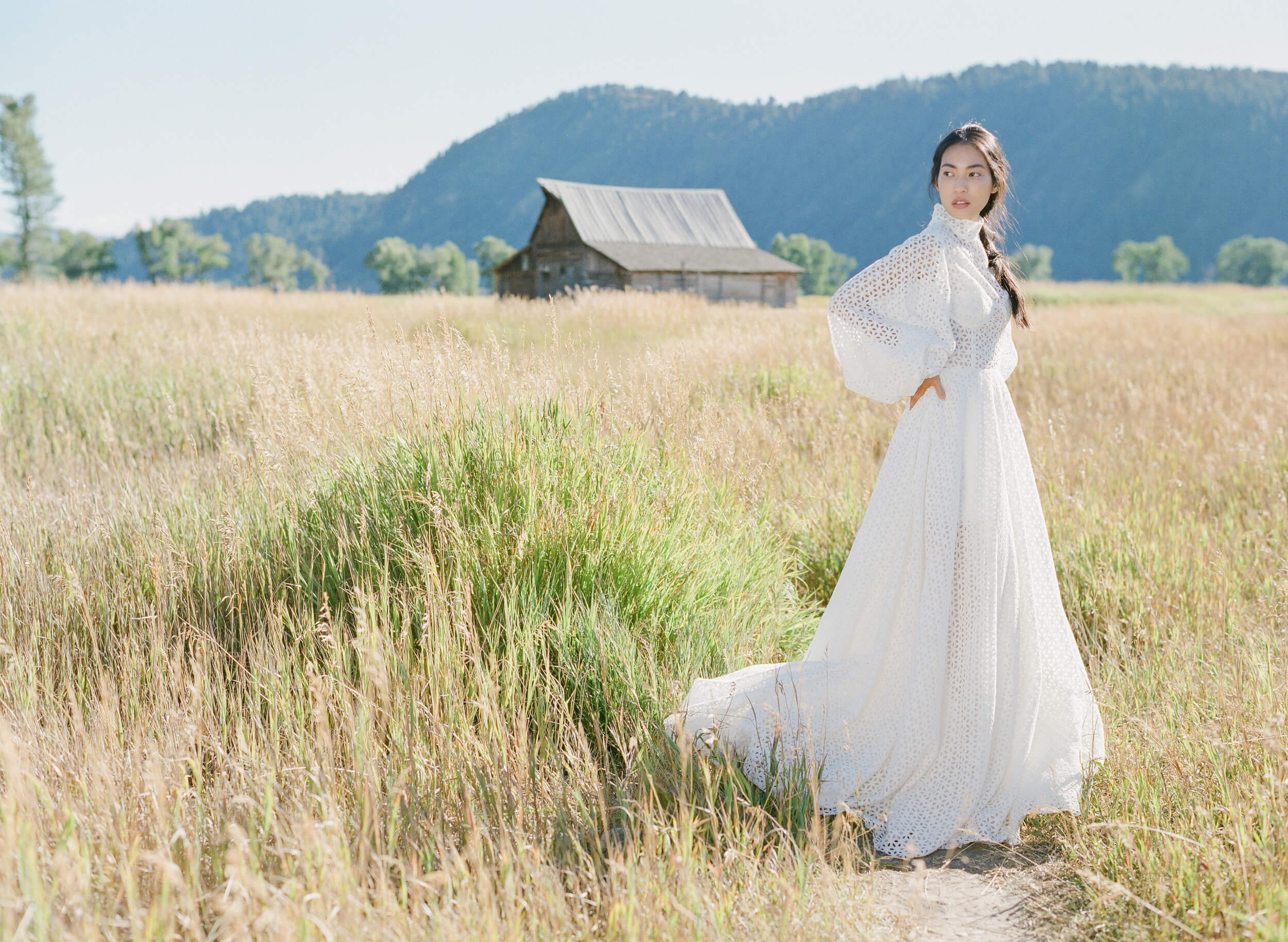 white eyelet long-sleeved gown by Teuta Matoshi
