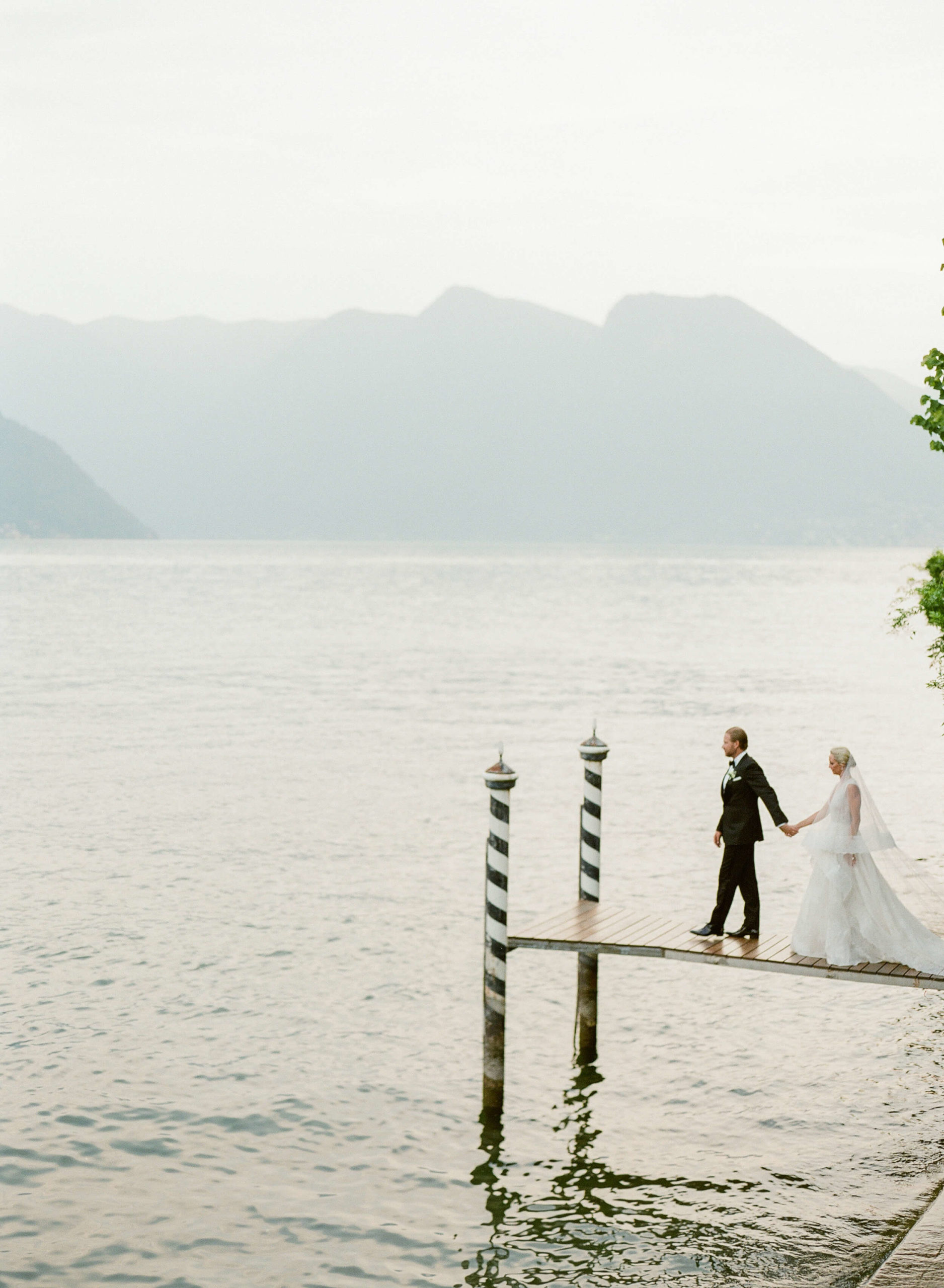 Lake Como destination wedding couple on pier