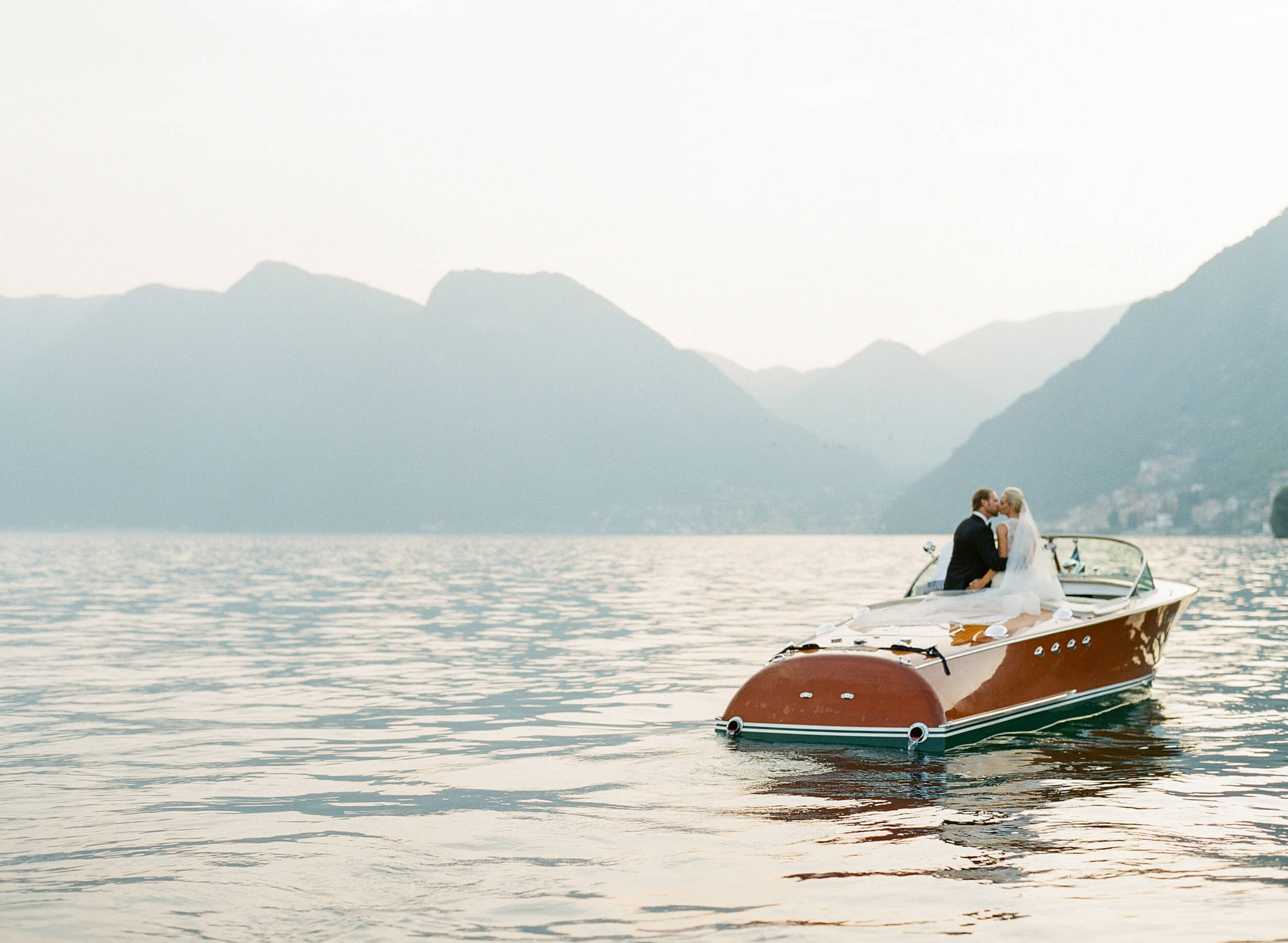 wedding couple in speed boat on Lake Como