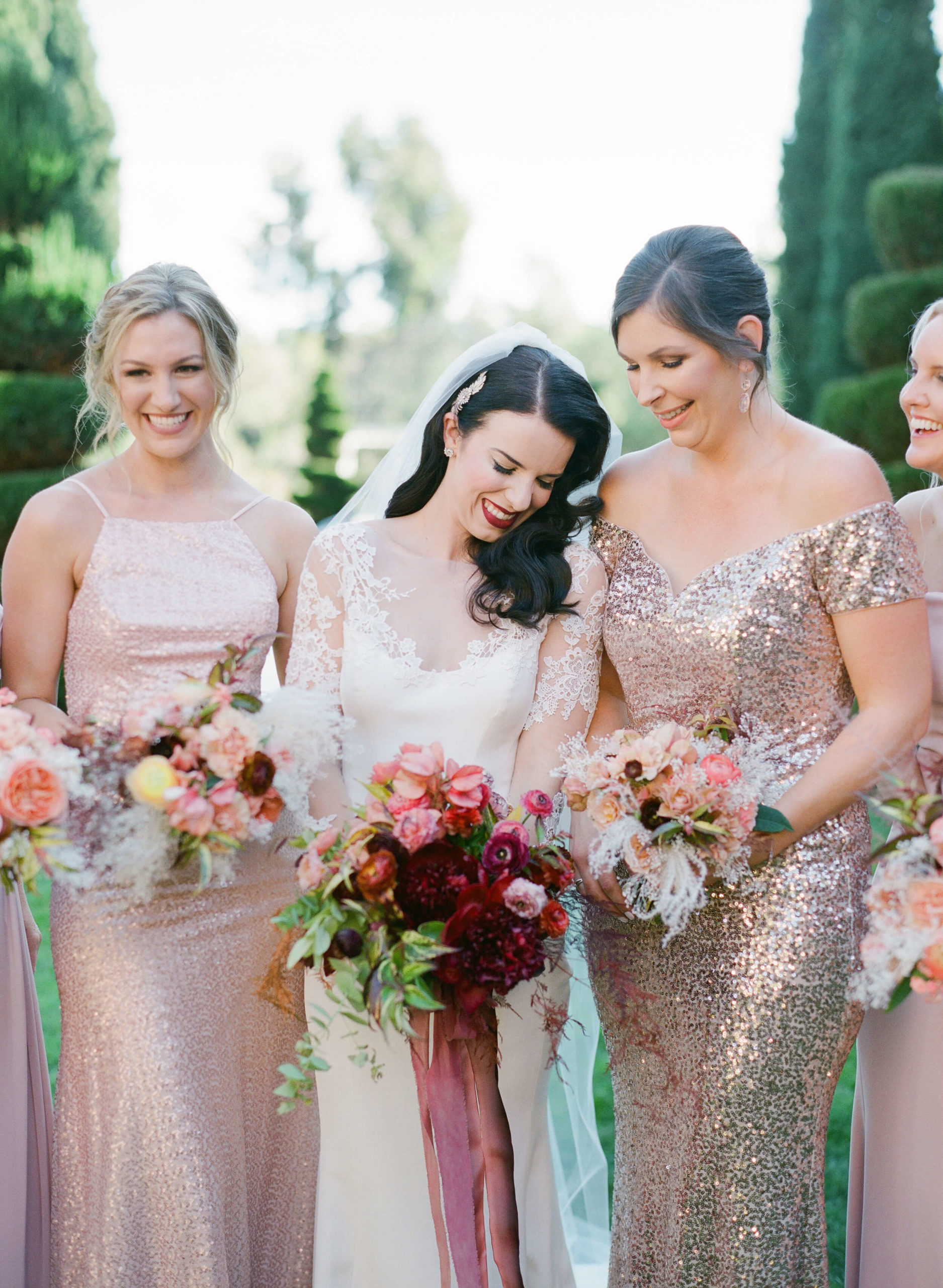 bridal party with colorful fall wedding bouquets