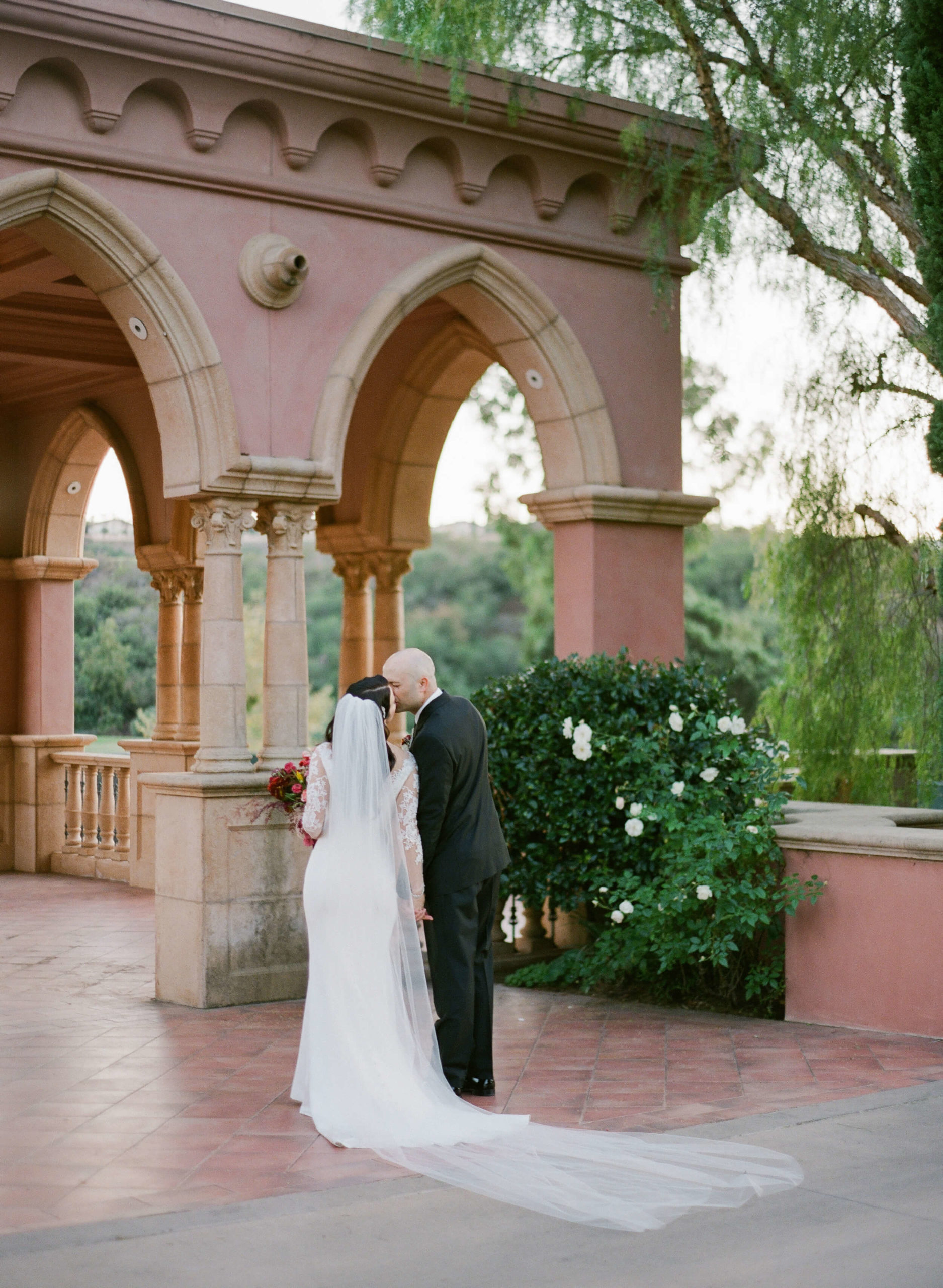 bride and groom kiss at Fairmont San Diego