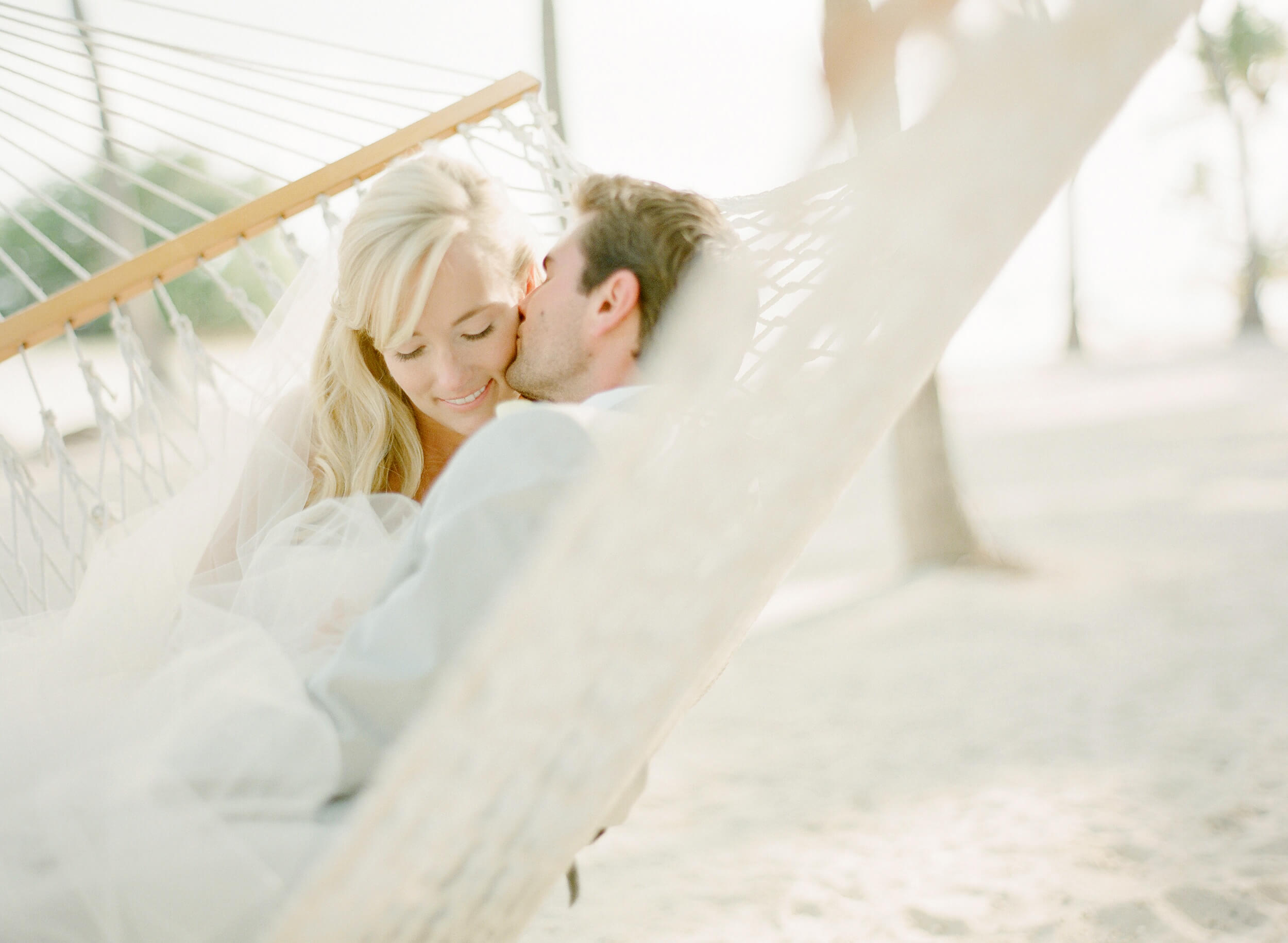 wedding couple in hammock on Florida beach