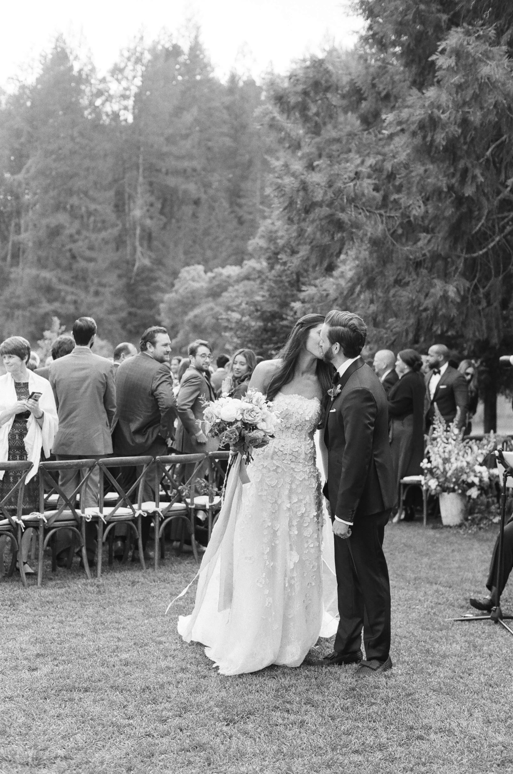 couple kiss at wedding ceremony in Napa Valley