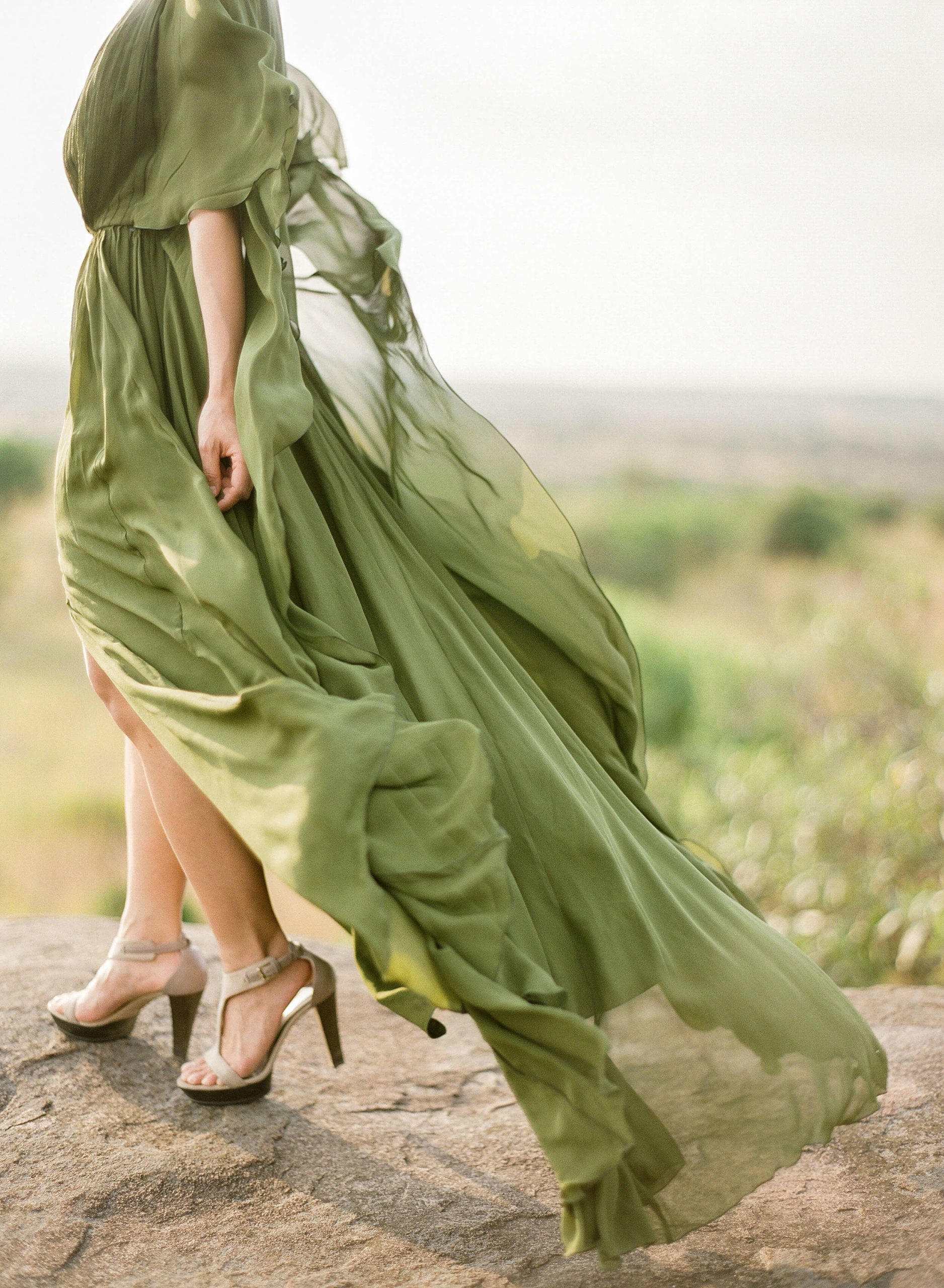 green flowing gown in African landscape