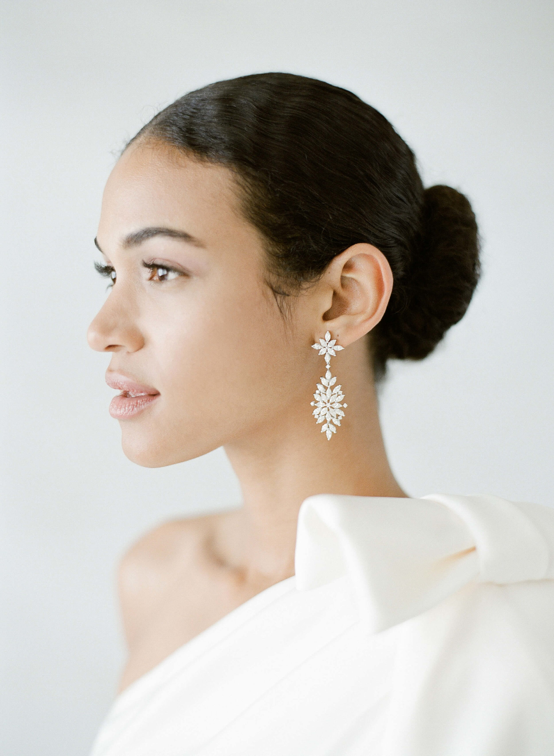 diamond drop earrings on BIPOC bride