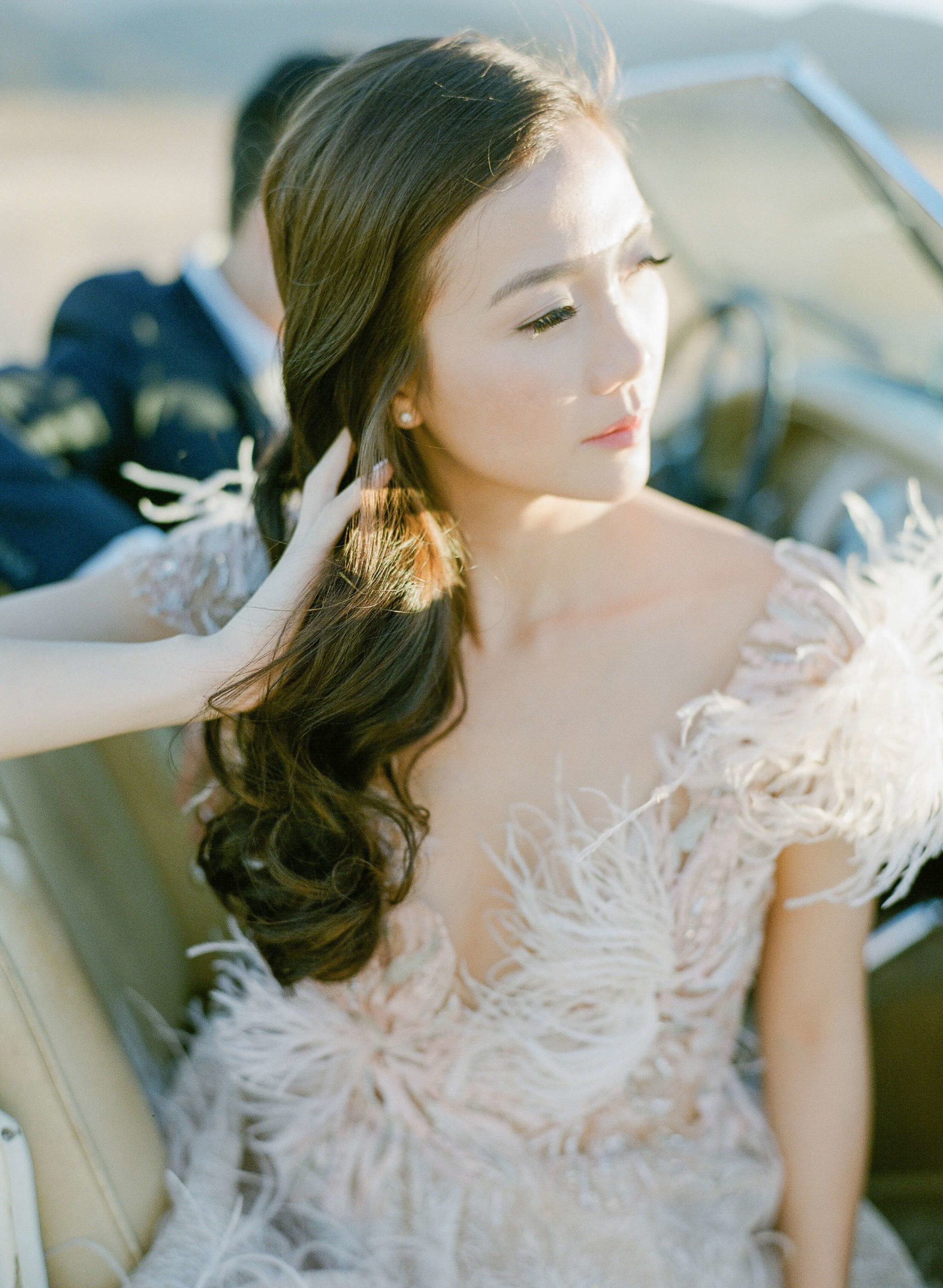 blush feathered gown on bride for engagement photo session