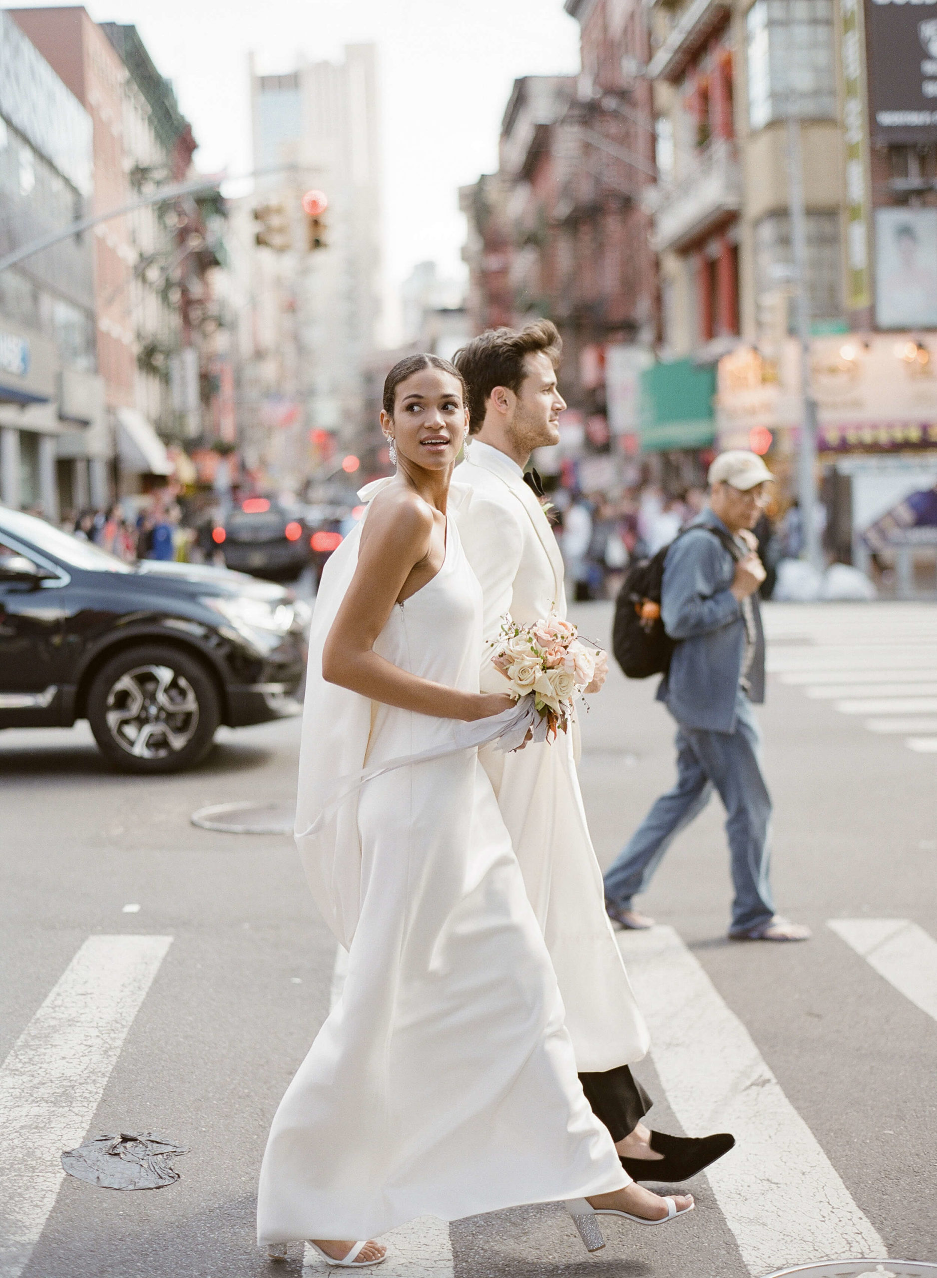New York City wedding couple walking crosswalk
