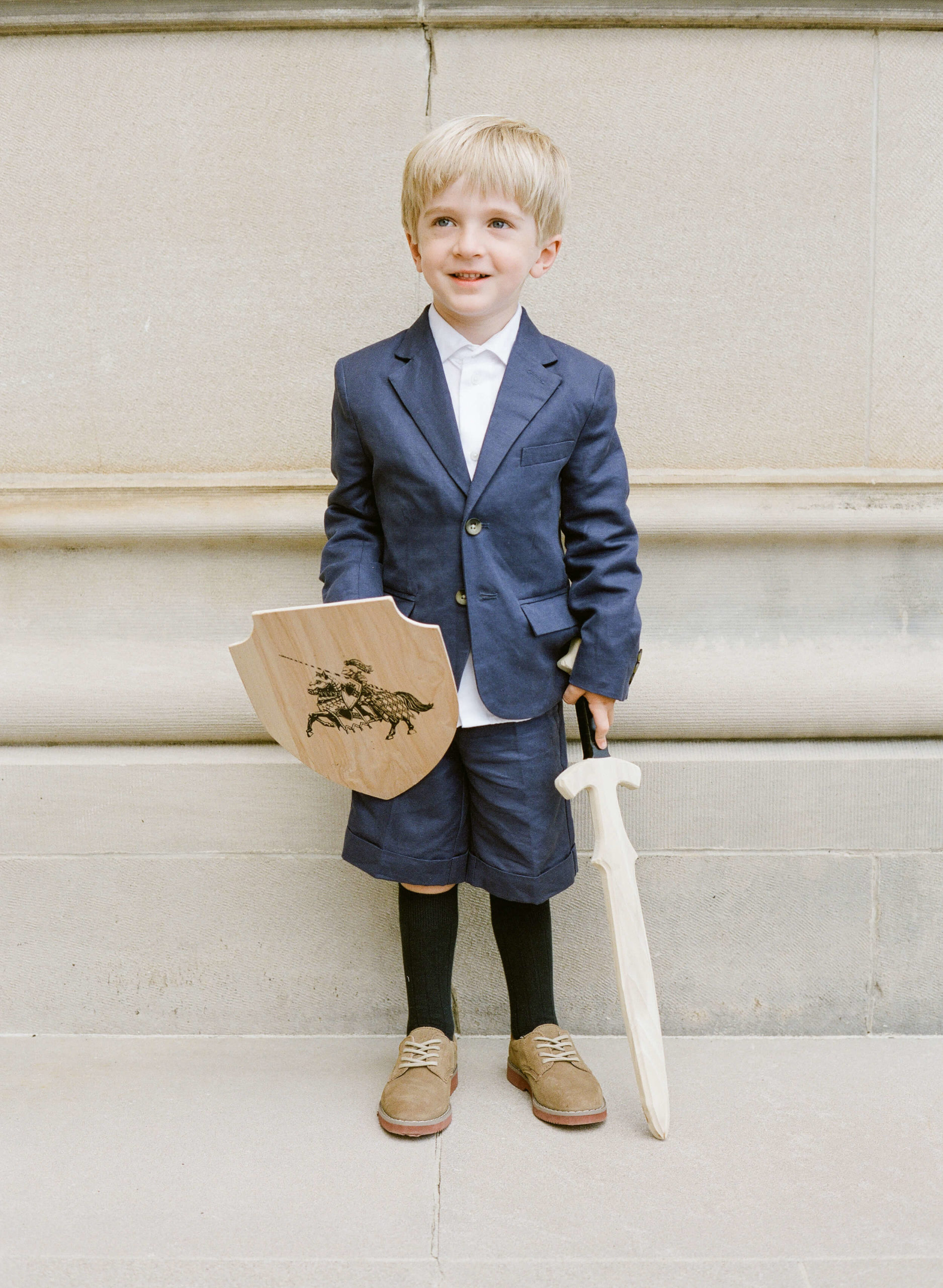 ring bearer with wooden sword and shield