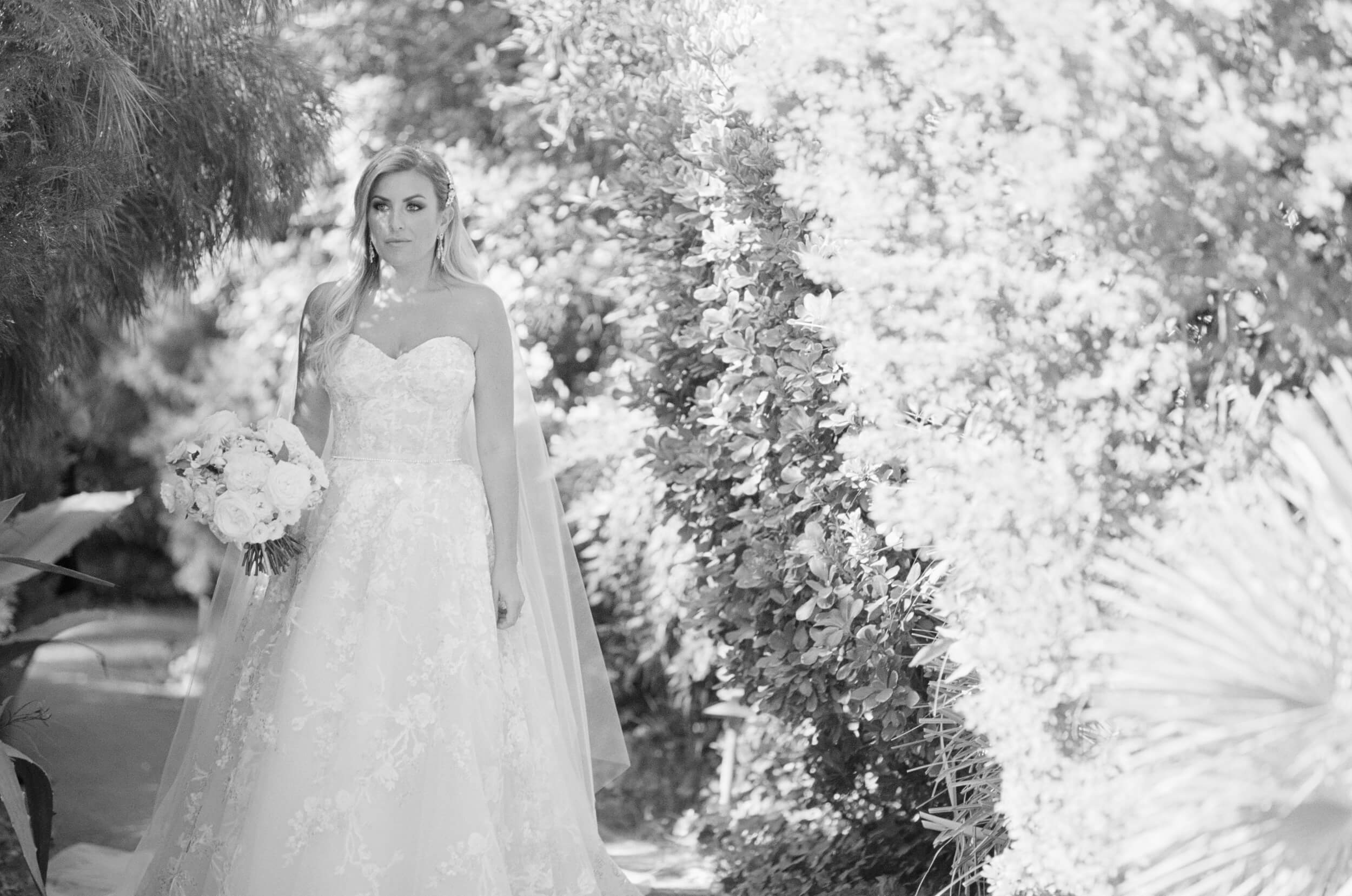 bride walks to first look with groom
