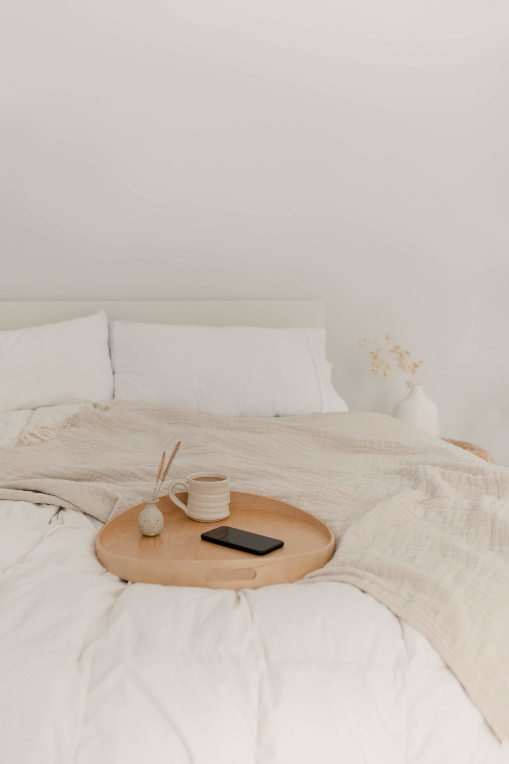 serene bedding with breakfast tray 