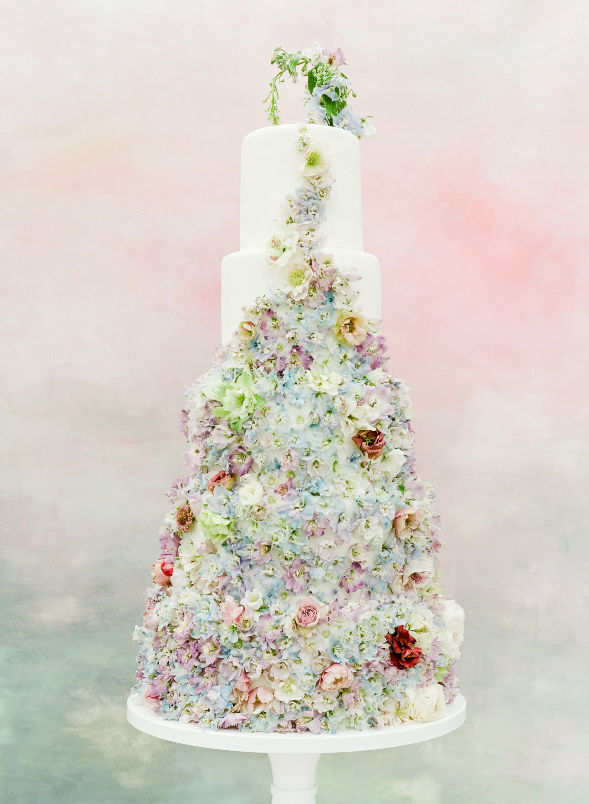 Use real seasonal flowers on wedding cake to give back through your wedding