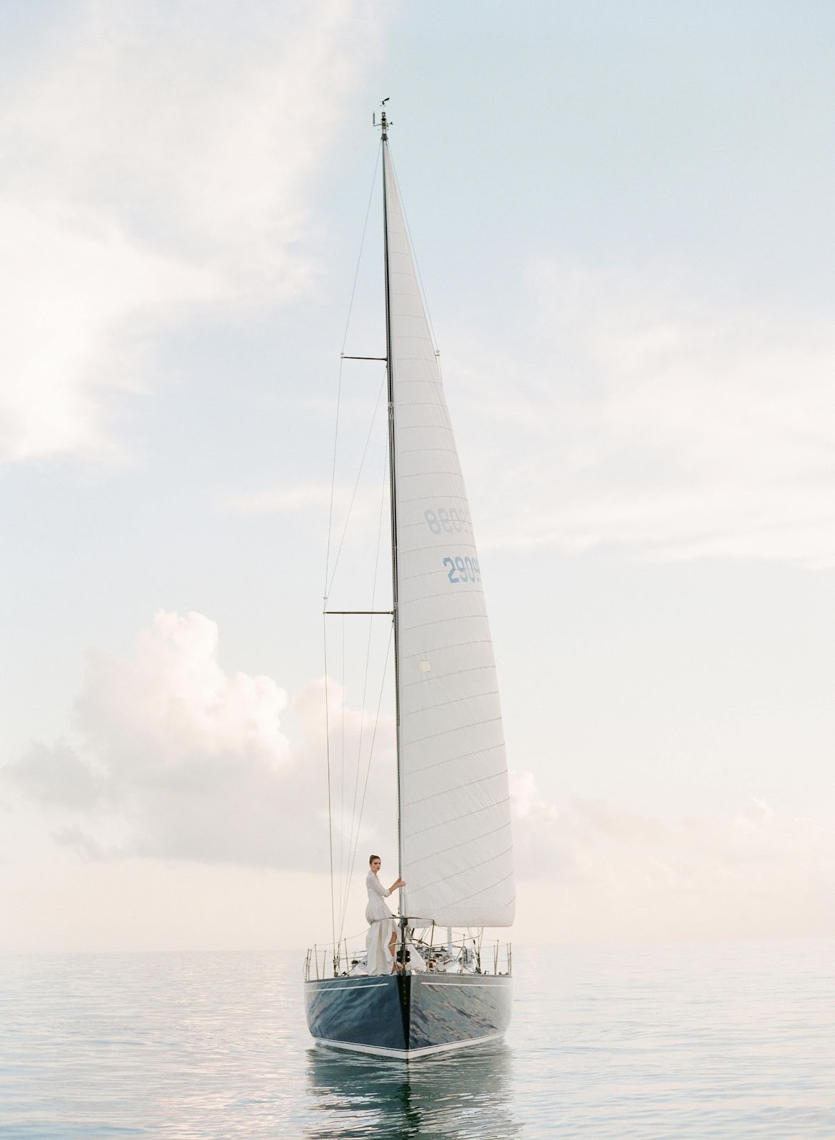 sailboat with model in Carolina Herrera bridal gown