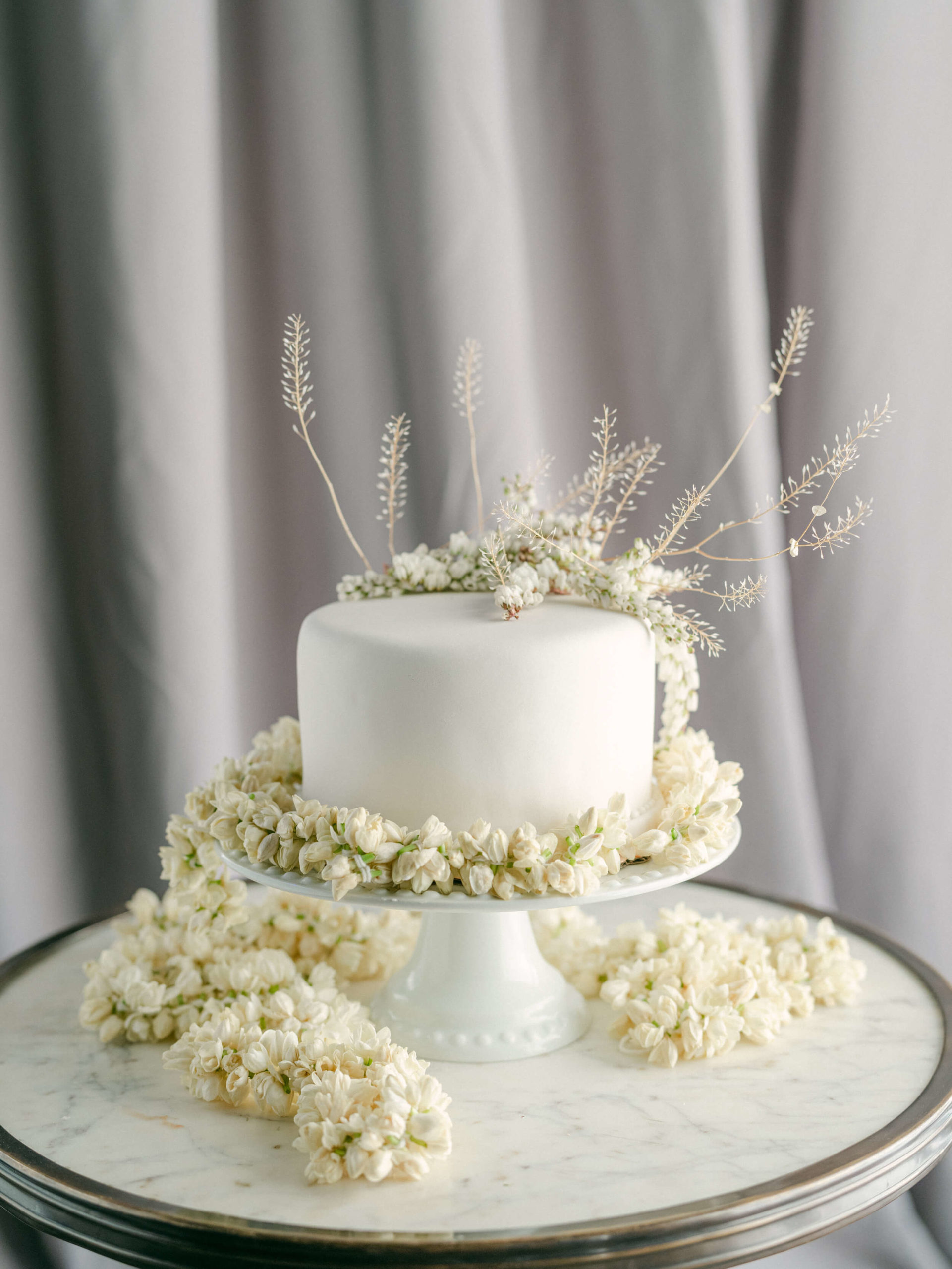 Wedding cake with baby's breath and white florals