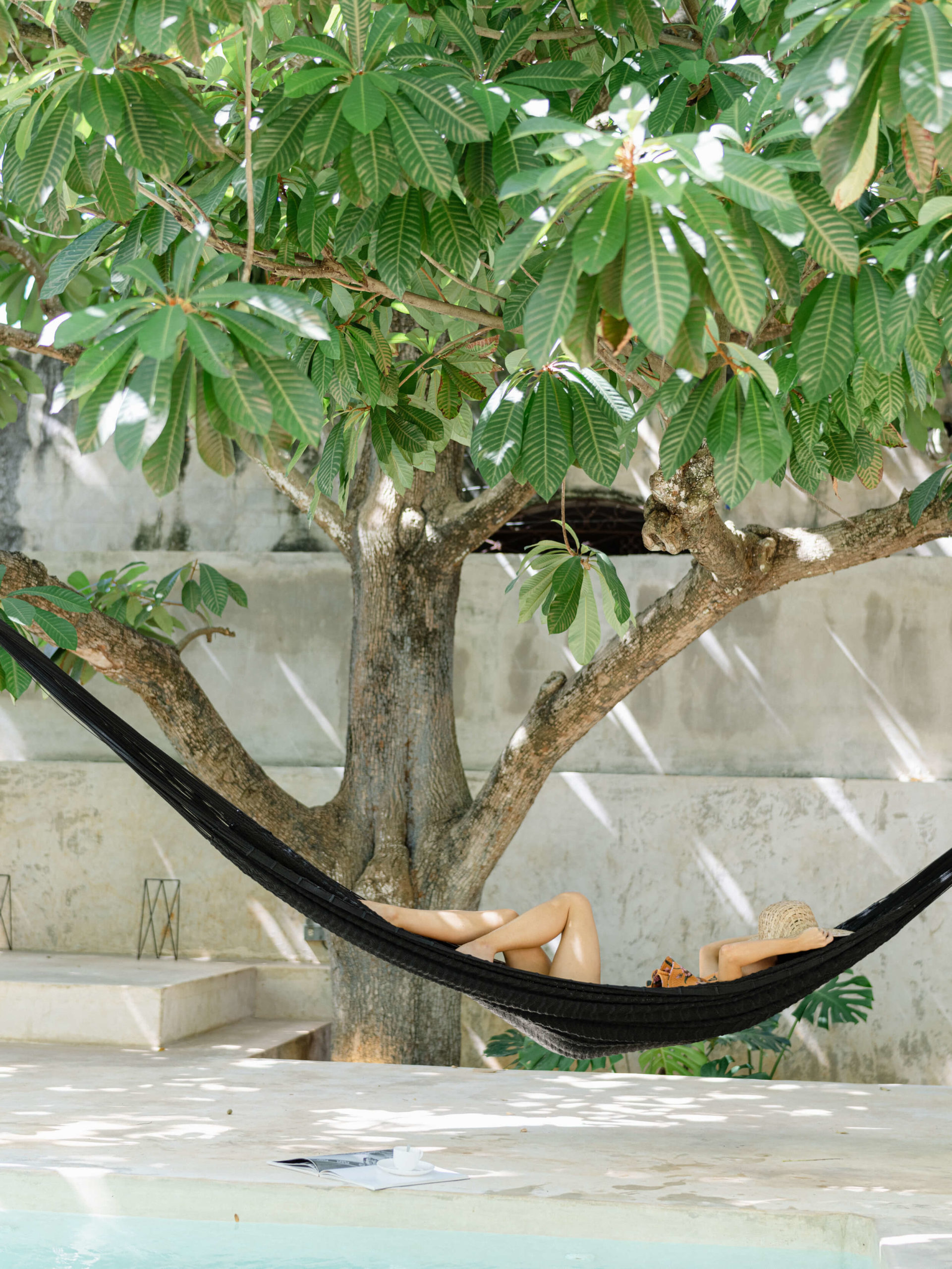 Bride in a hammock by the pool
