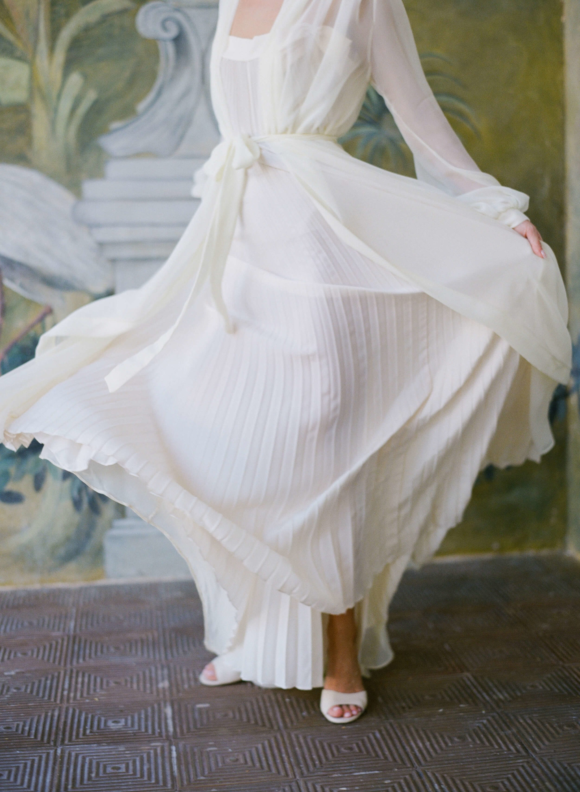 Bride twirls in flowing dressing gown