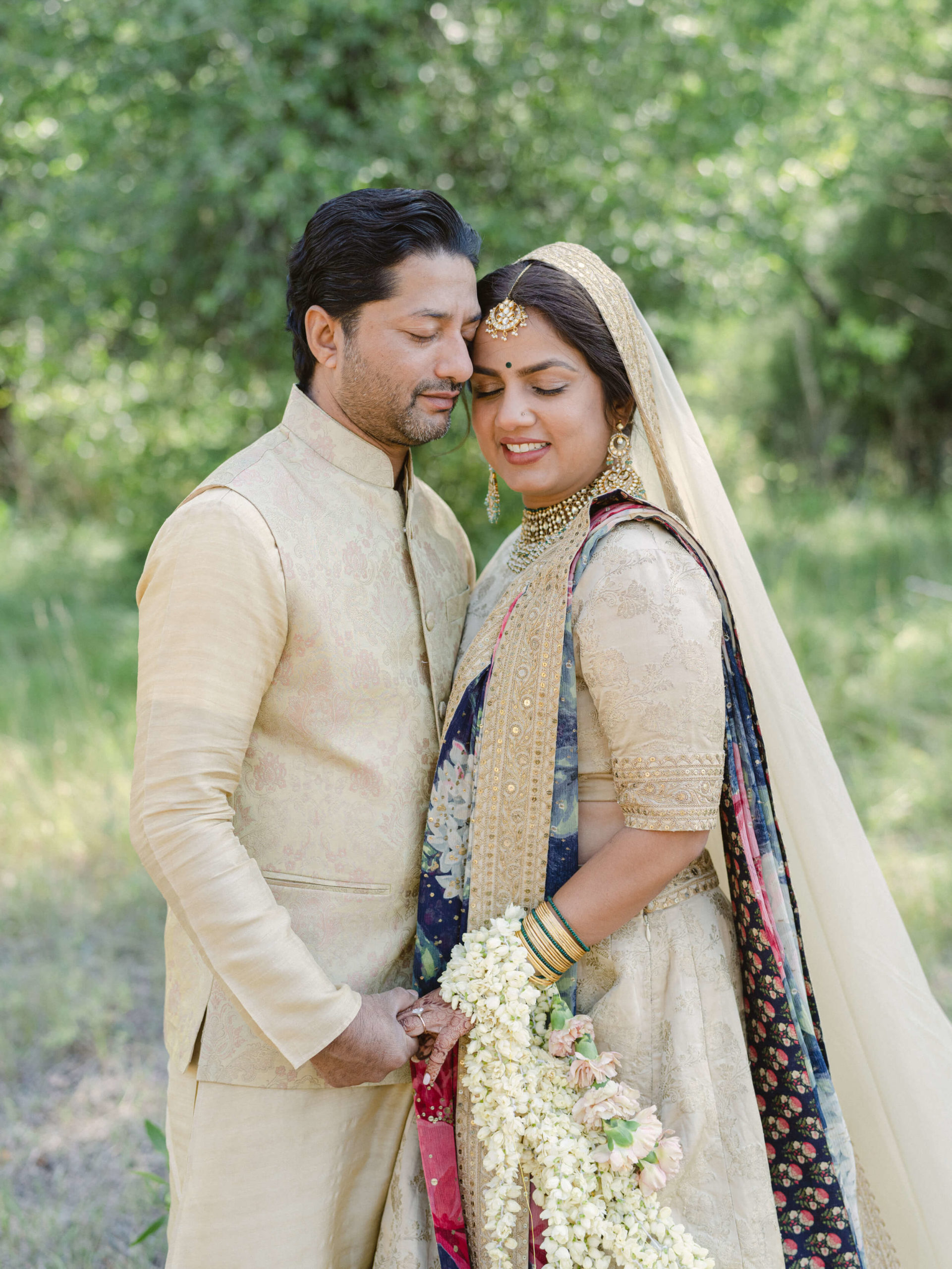 Sapna and Ari smiling before their Indian wedding