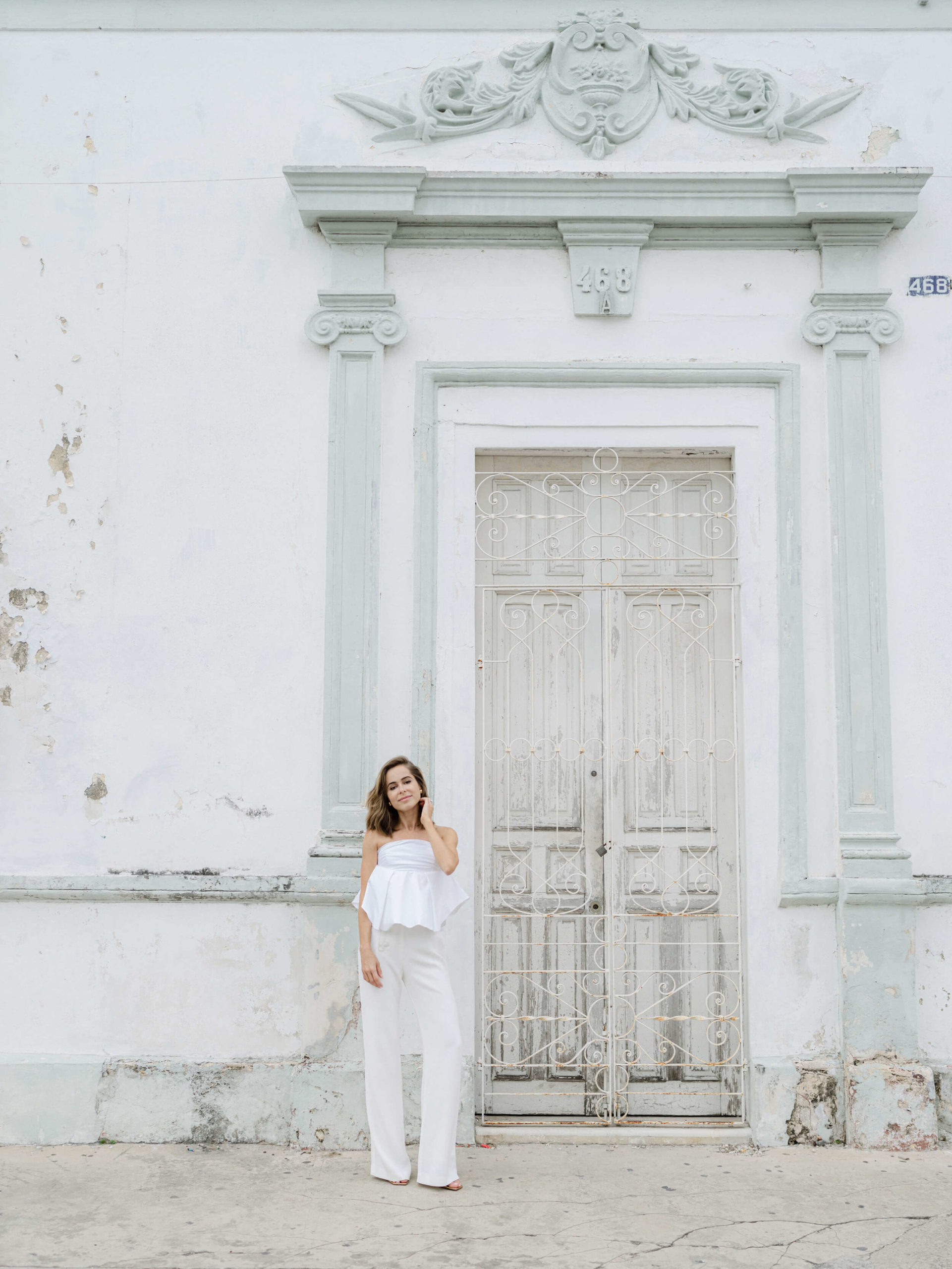 Bride posing outside an old building