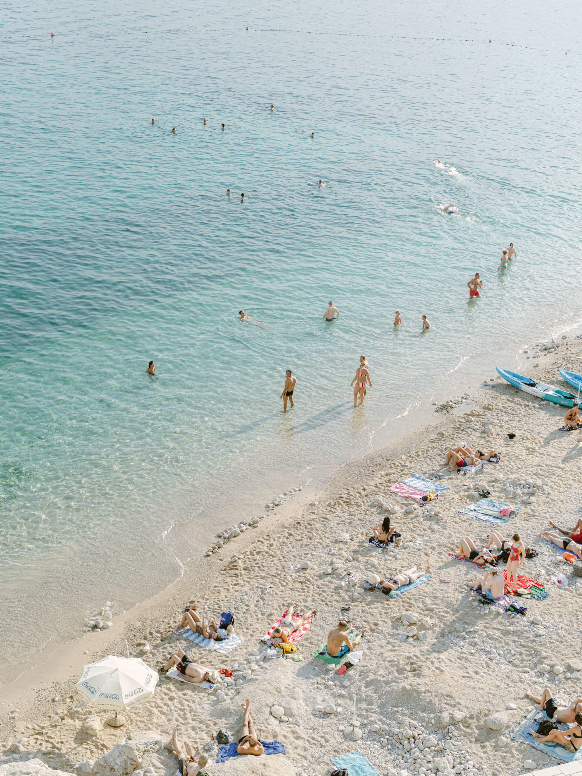 Aerial shot of people enjoying a Croatian beach