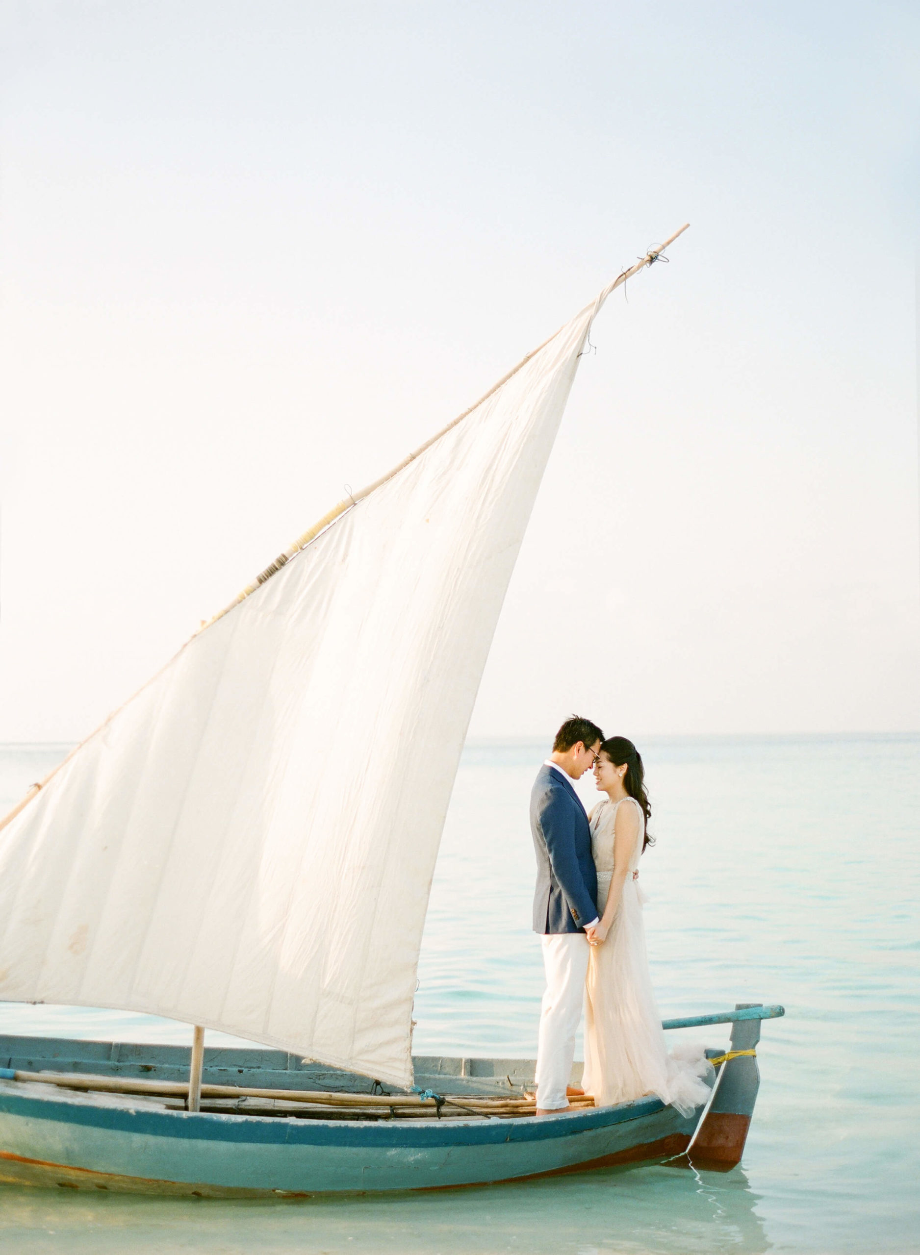 Bride and groom on a sailboat in the Maldives