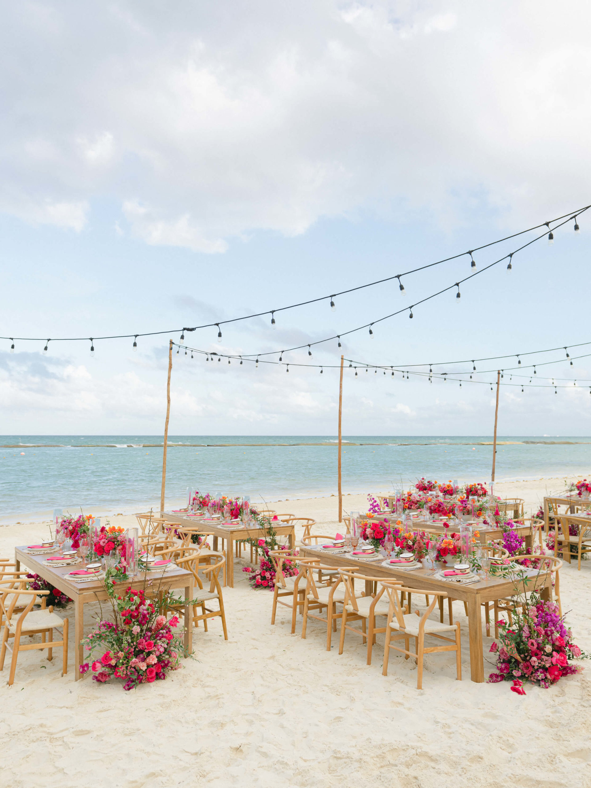Table settings on the beach at Rosewood Mayakoba wedding