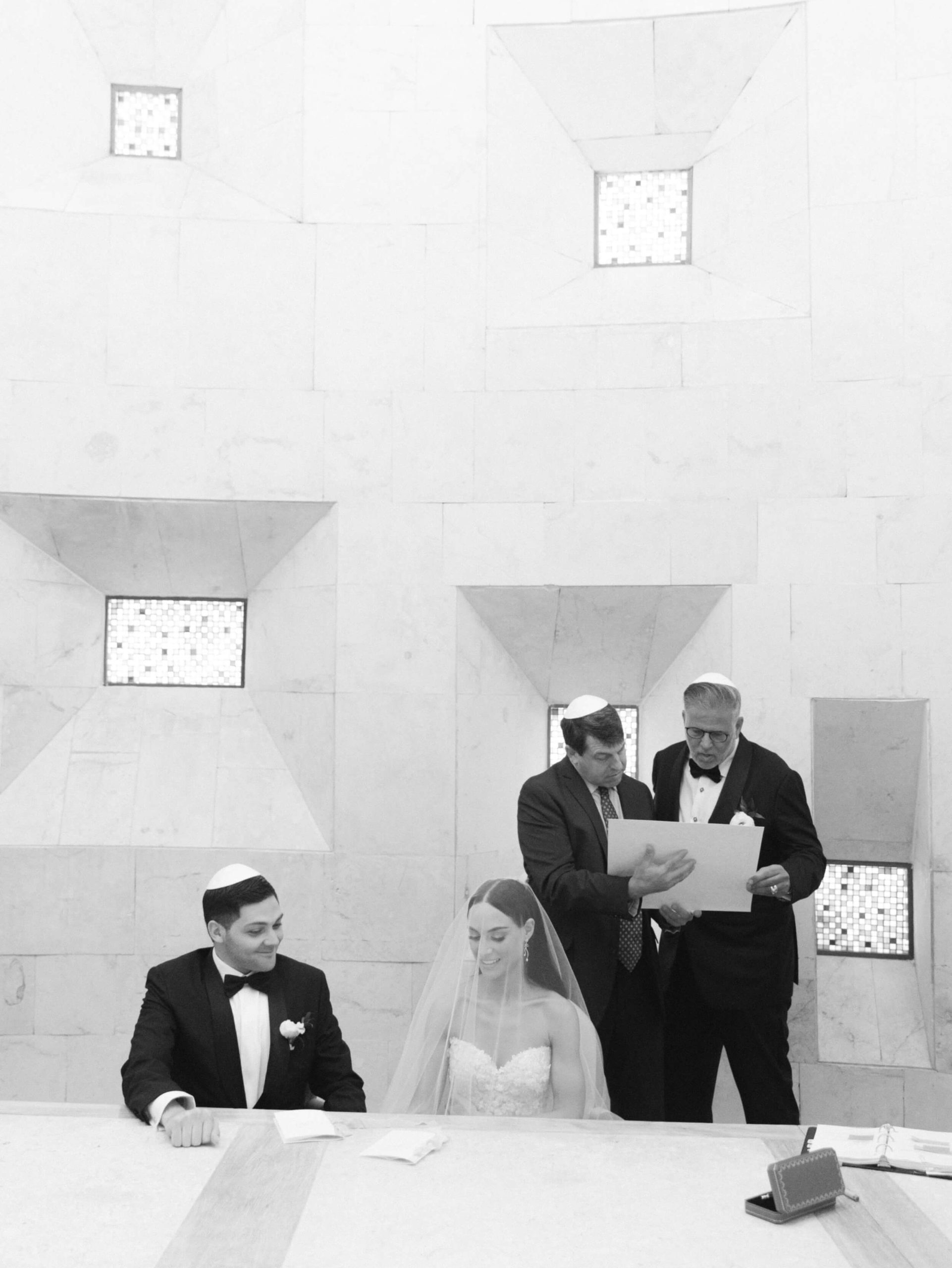 Danielle and Lucas participating in their Jewish Ketubah Signing
