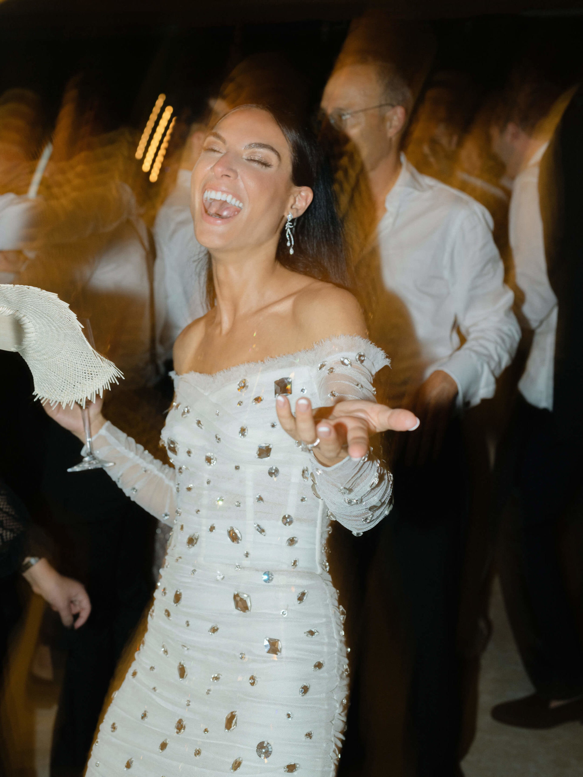 Danielle dancing and laughing at her wedding reception