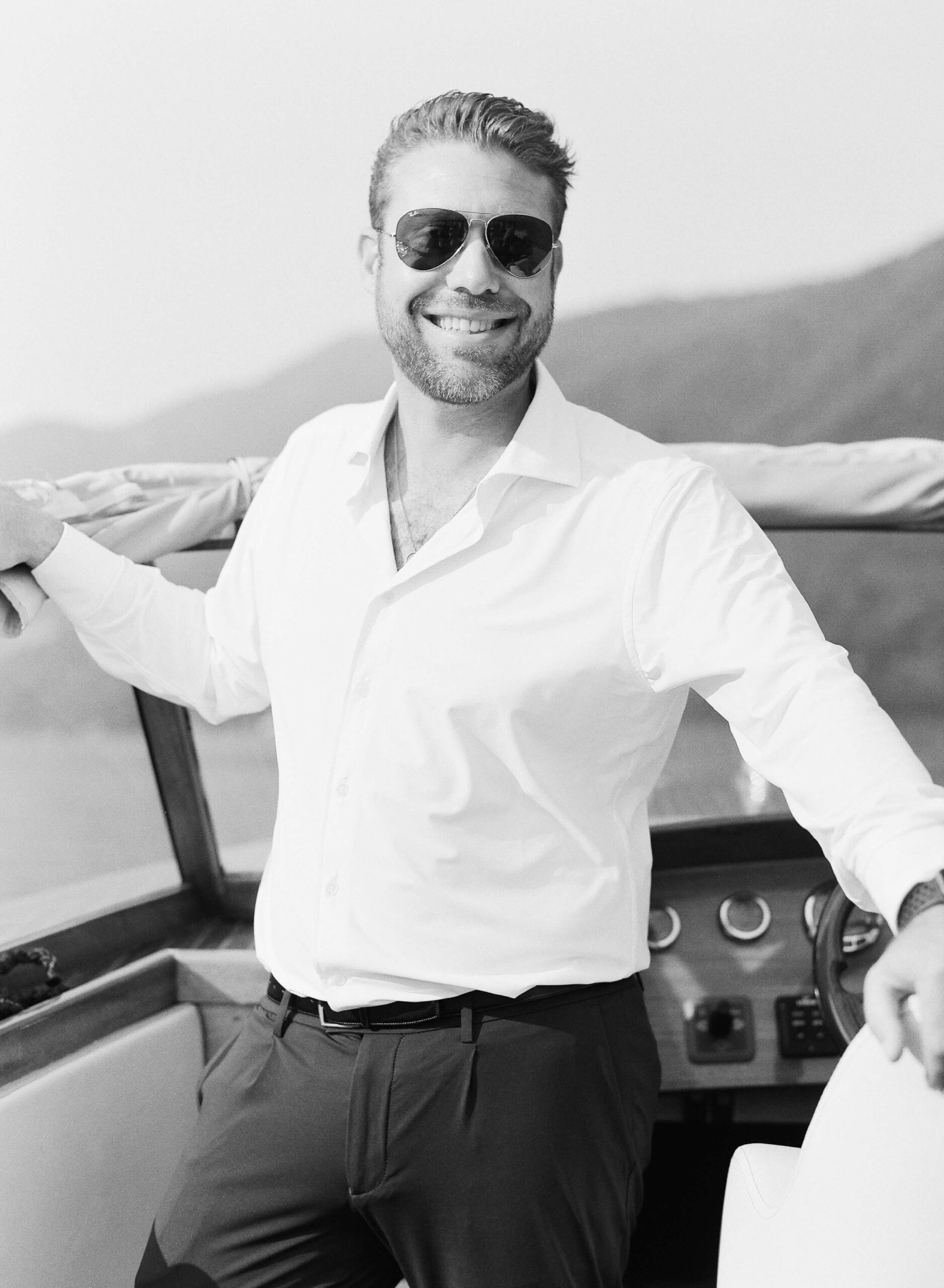 Nick smiling on a boat