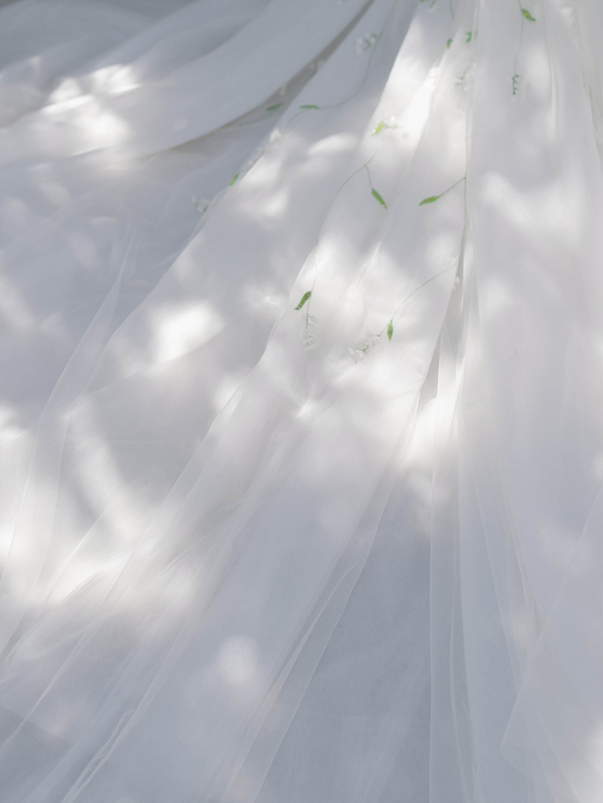 Sunlight and shadows on Monique Lhuillier’s Lily of the Valley wedding dress