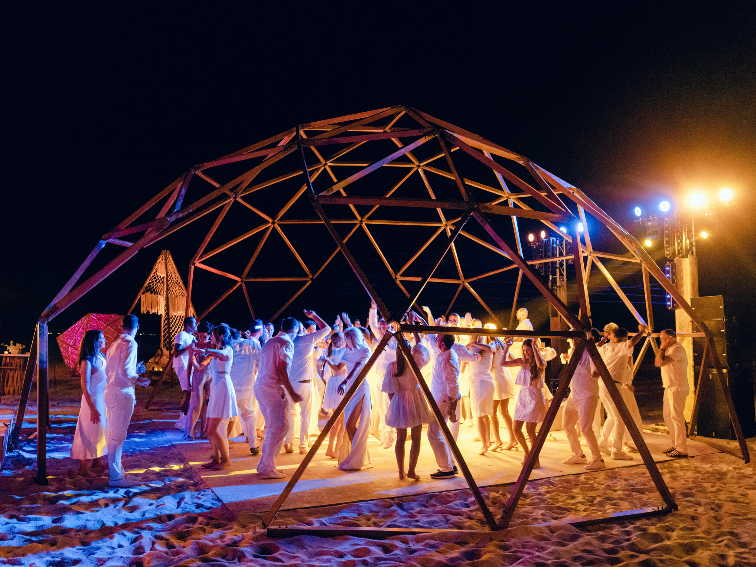 Guests dancing under a custom built structure