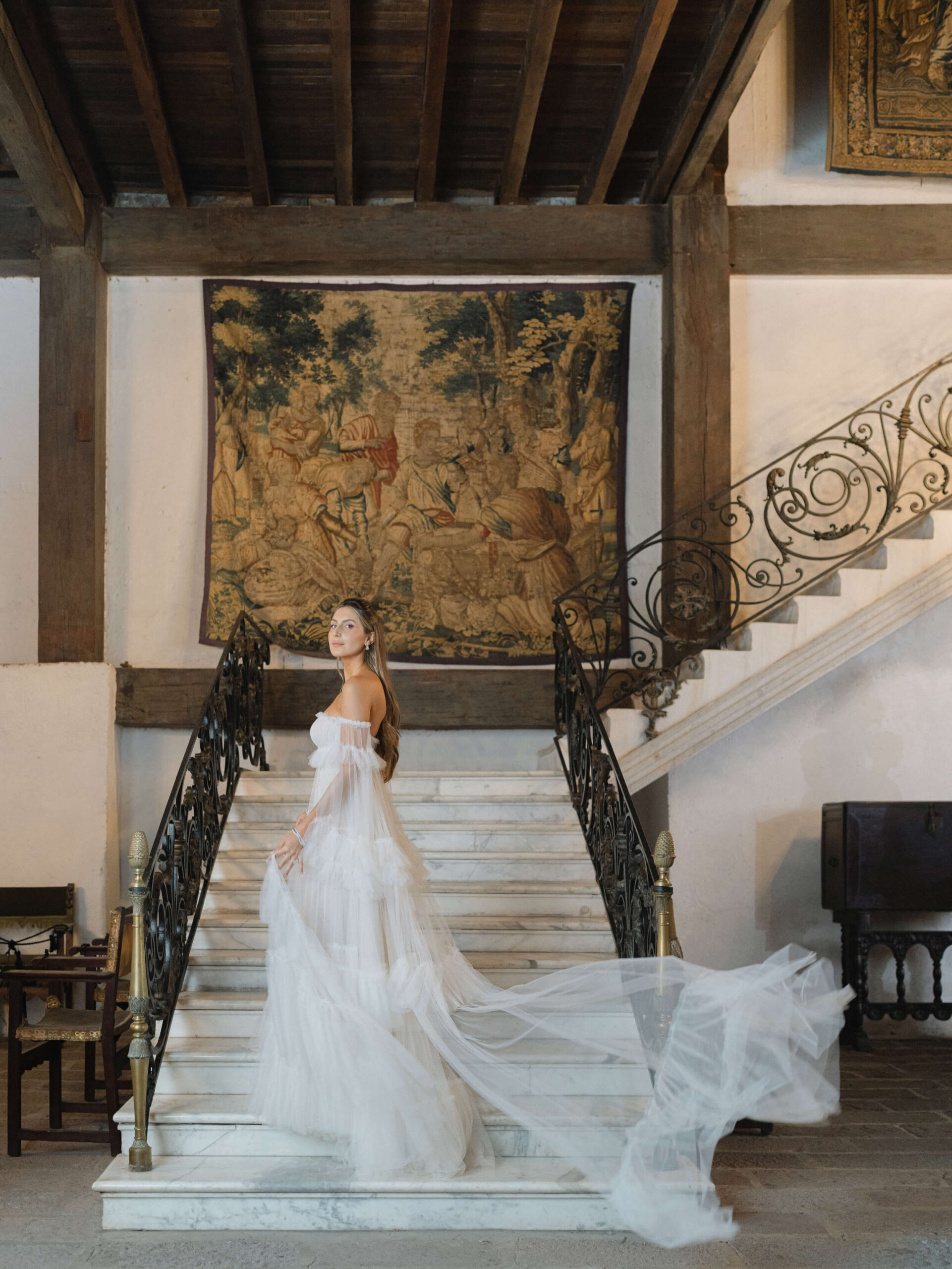Ashley posing on the stairs at the Santa Mónica Hacienda Museum in her Vera Wang dress