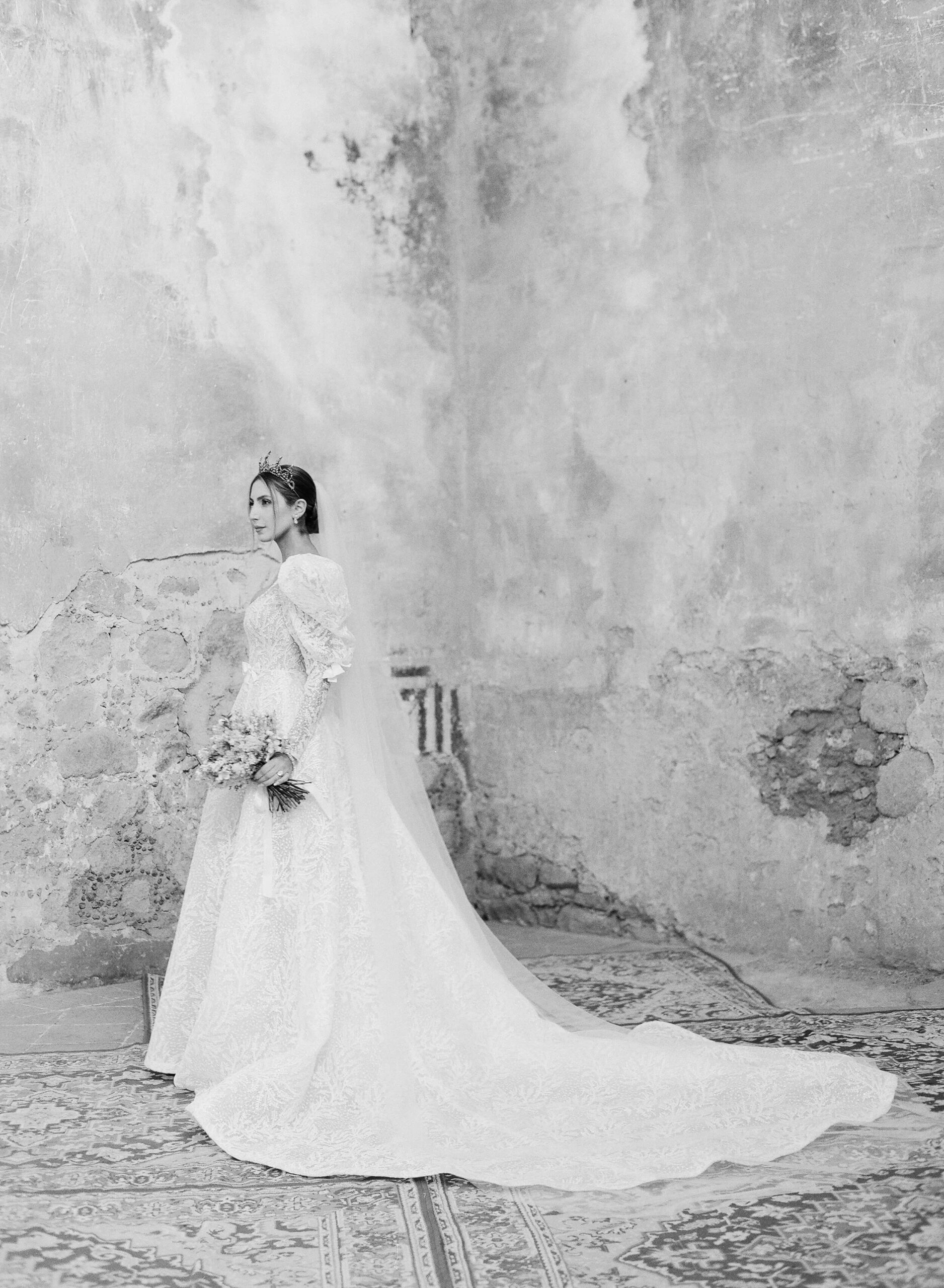 Black and white shot of Ashley wearing her Reem Acra wedding dress and vintage crown, holding her bouquet