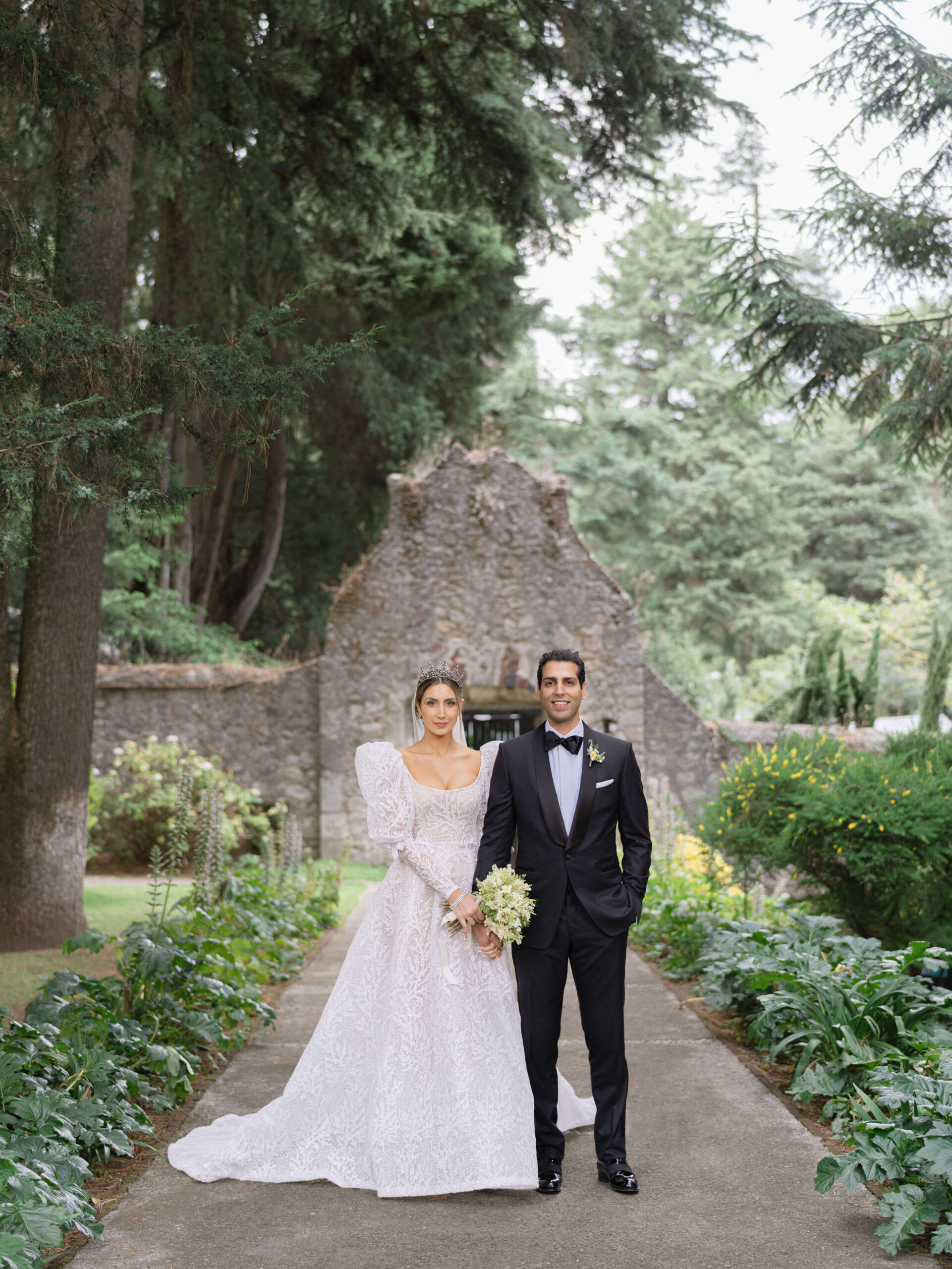 Ashley and Brian posing in front of an ancient convent before their Mexico City wedding