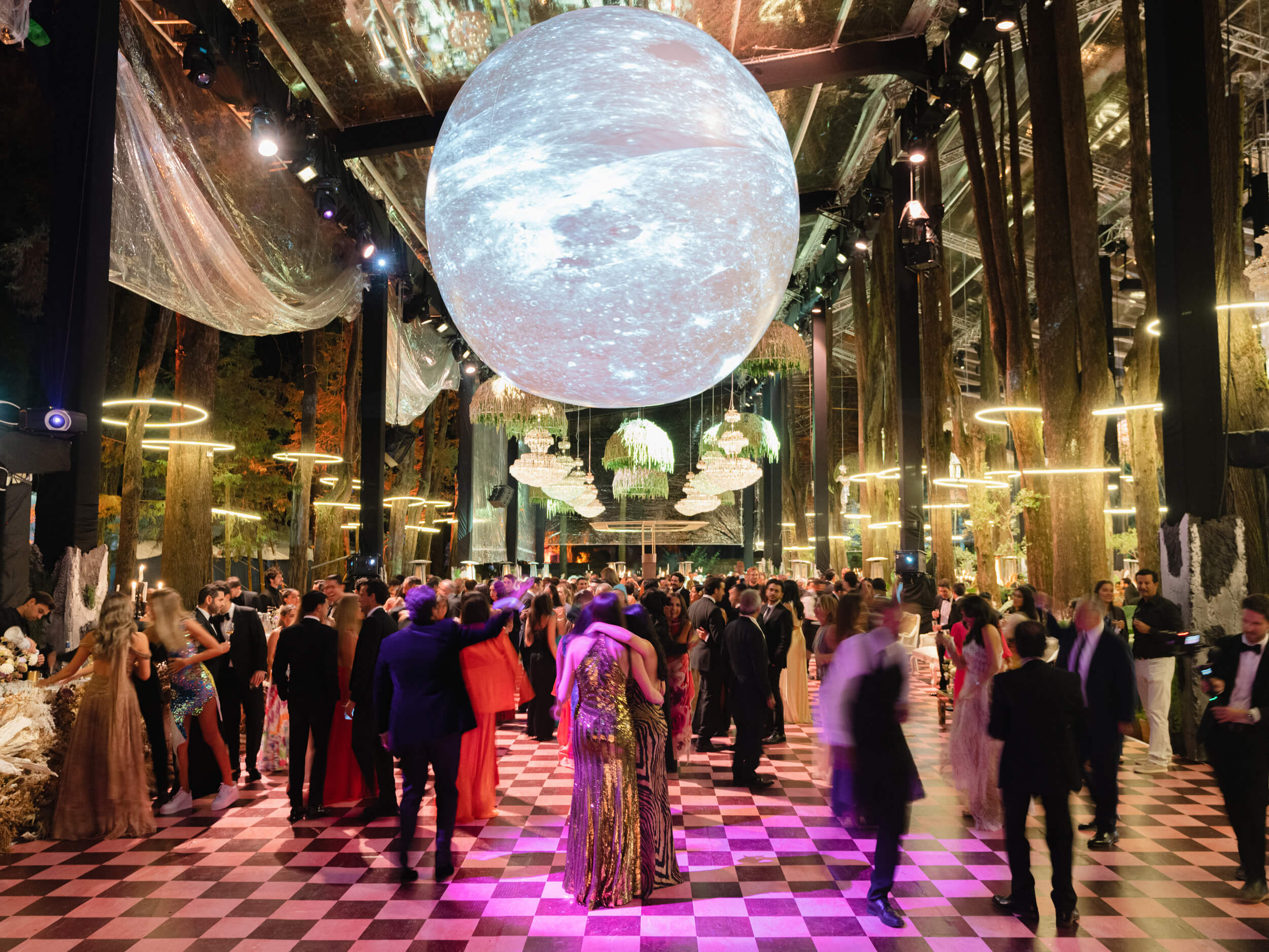 Guests celebrating under a man-made moon