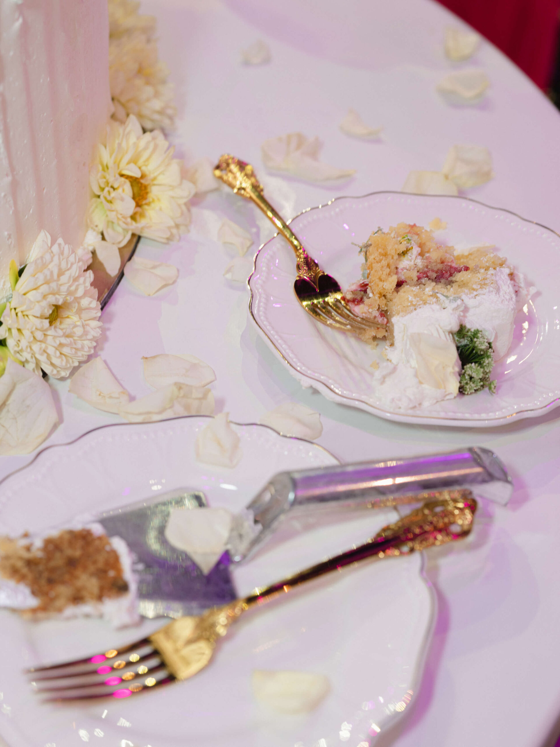 Plates, cutlery, and wedding cake