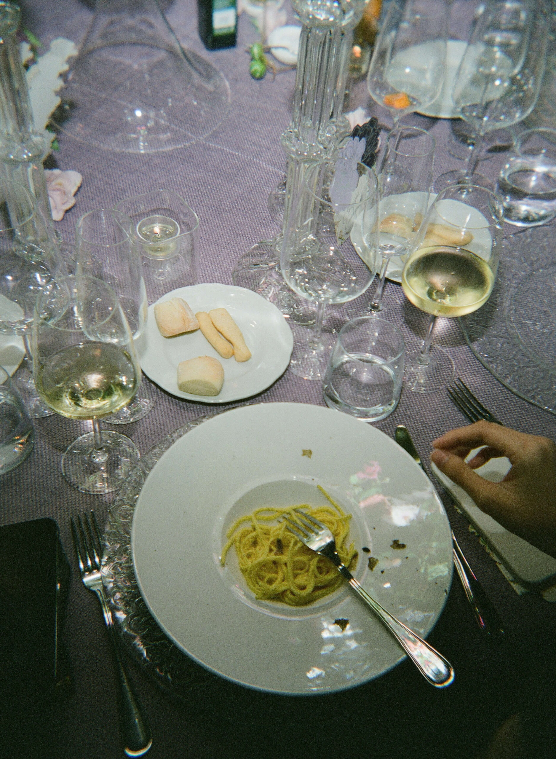 food and wine at the dinner table